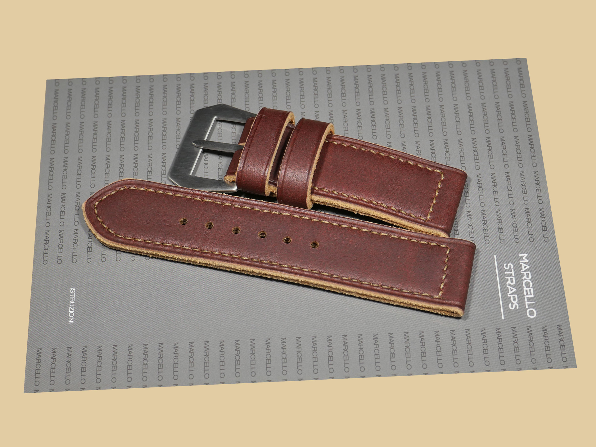 Soft Panerai Strap 47mm against a leather background.