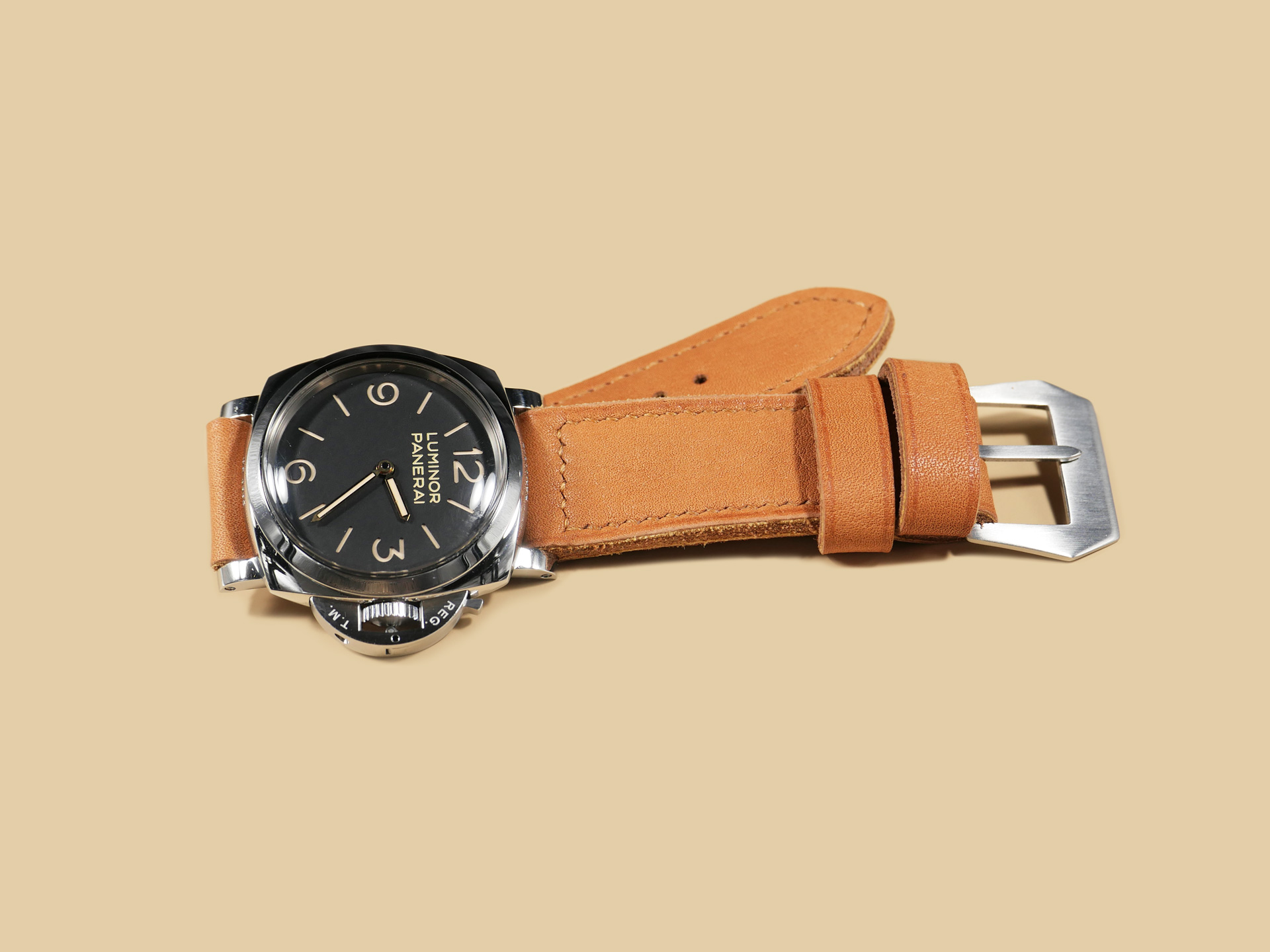 Handmade Thick Orange Panerai strap for 47mm Panerai watches displayed on wood