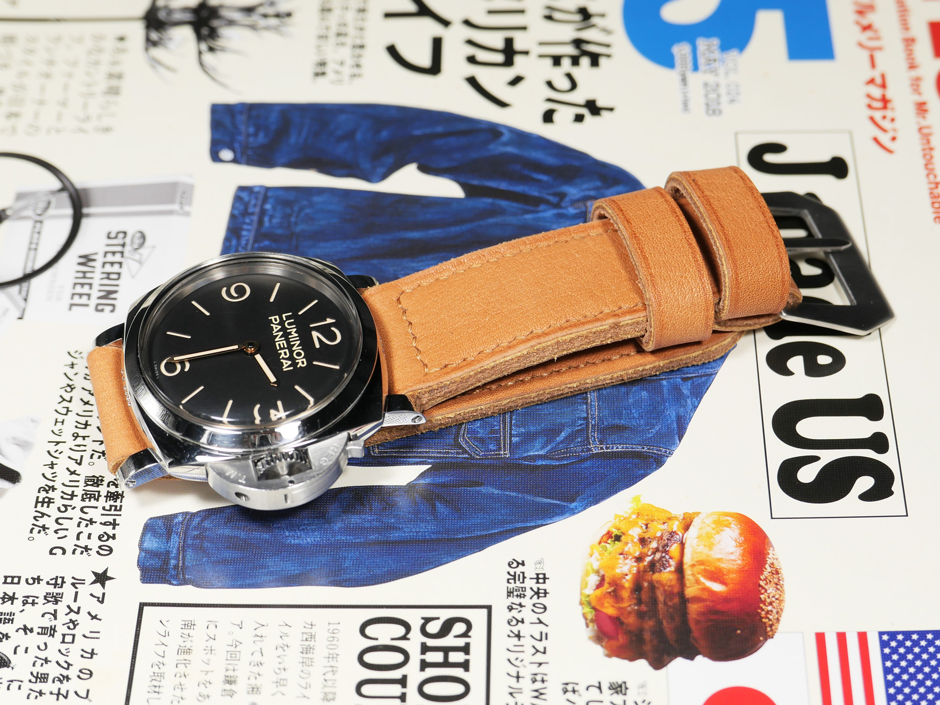 Top-down view of a Thick Orange Panerai strap for 47mm Panerai watches on a display stand