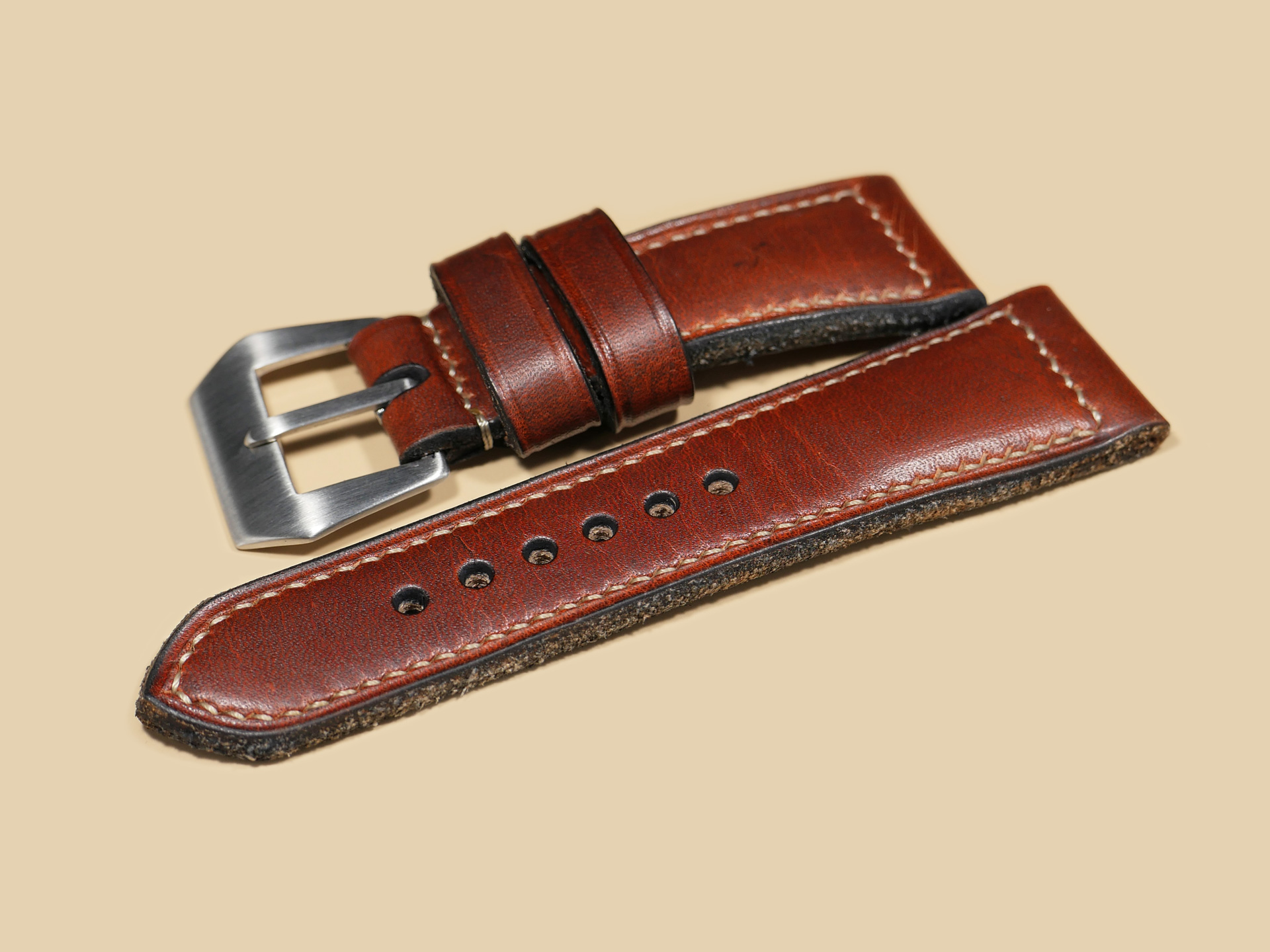 Detailed shot of dyed, burnished, and distressed strap edge