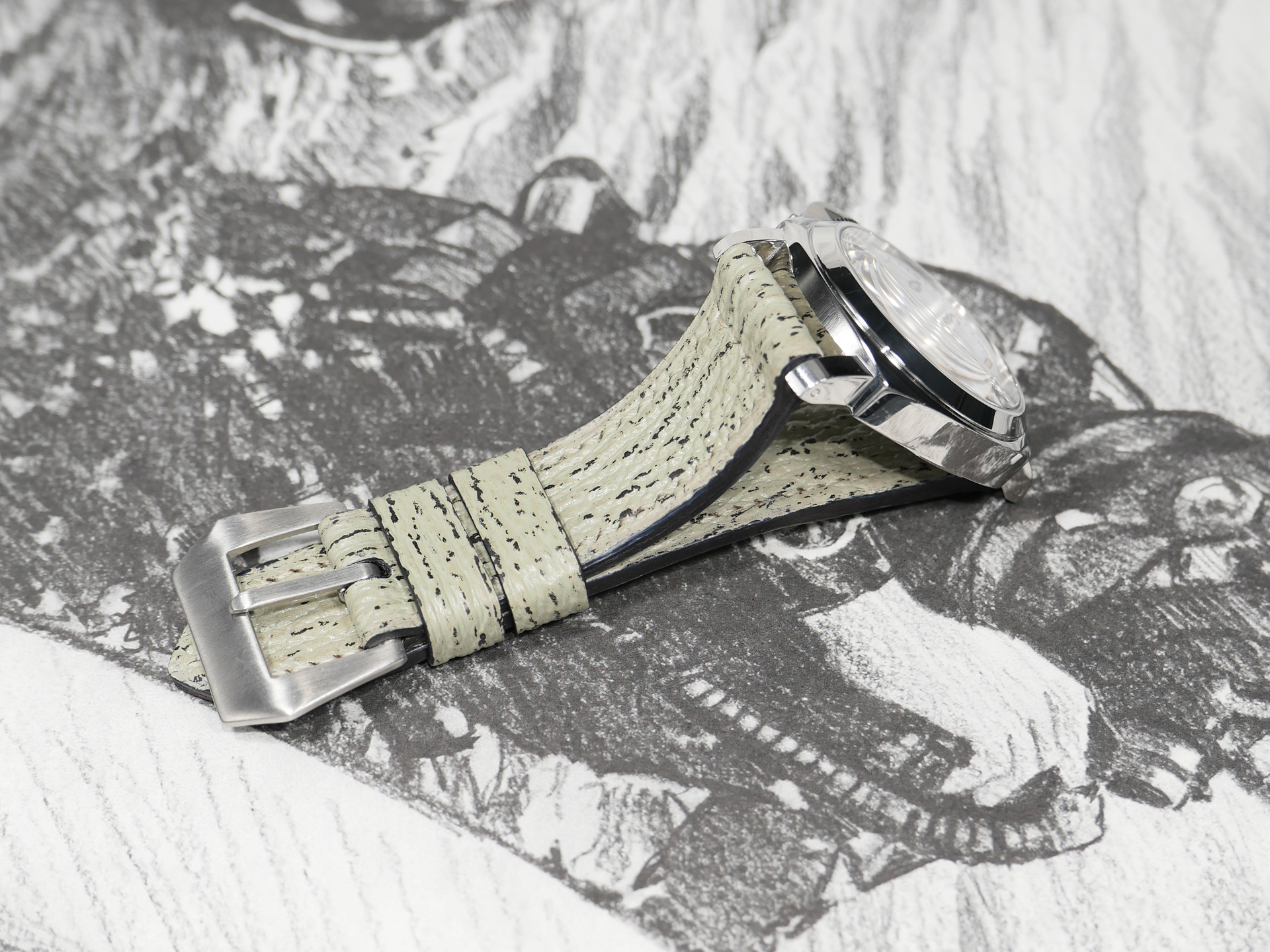 Flat lay of mint grey shark skin strap with Panerai hardware