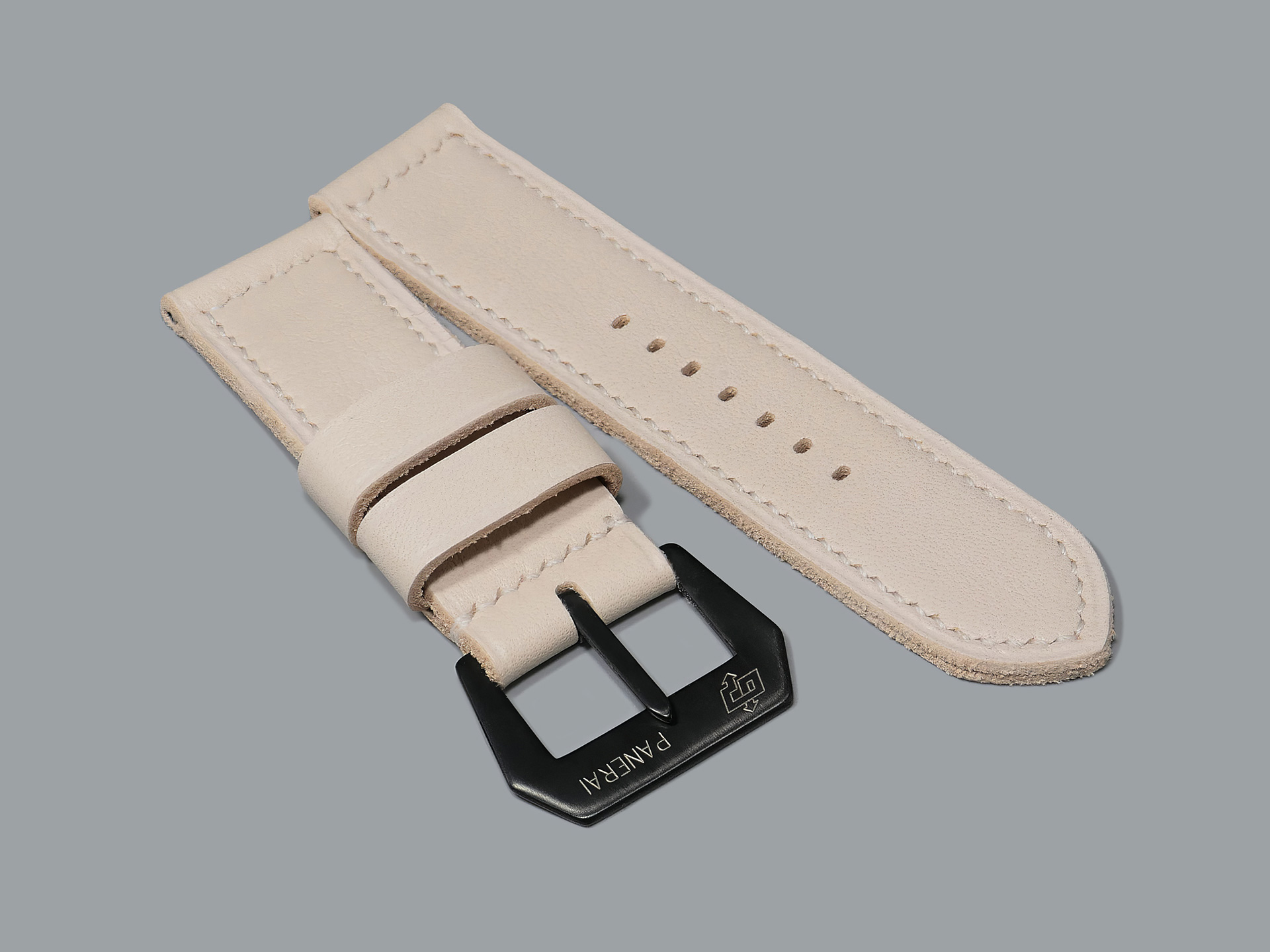 Close-up of beige box stitching on white Panerai strap