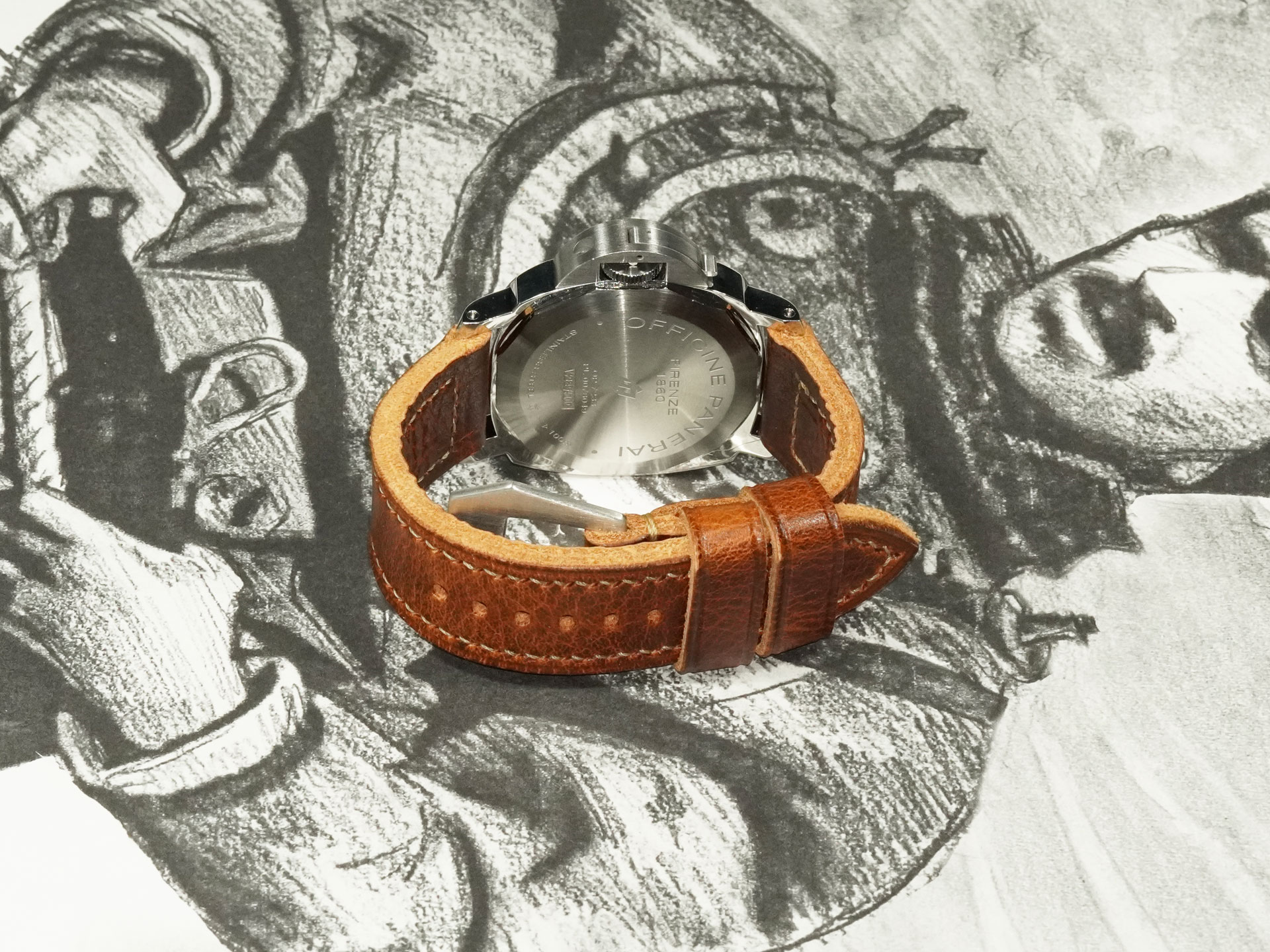 thick brown Panerai strap 44mm laid flat on table