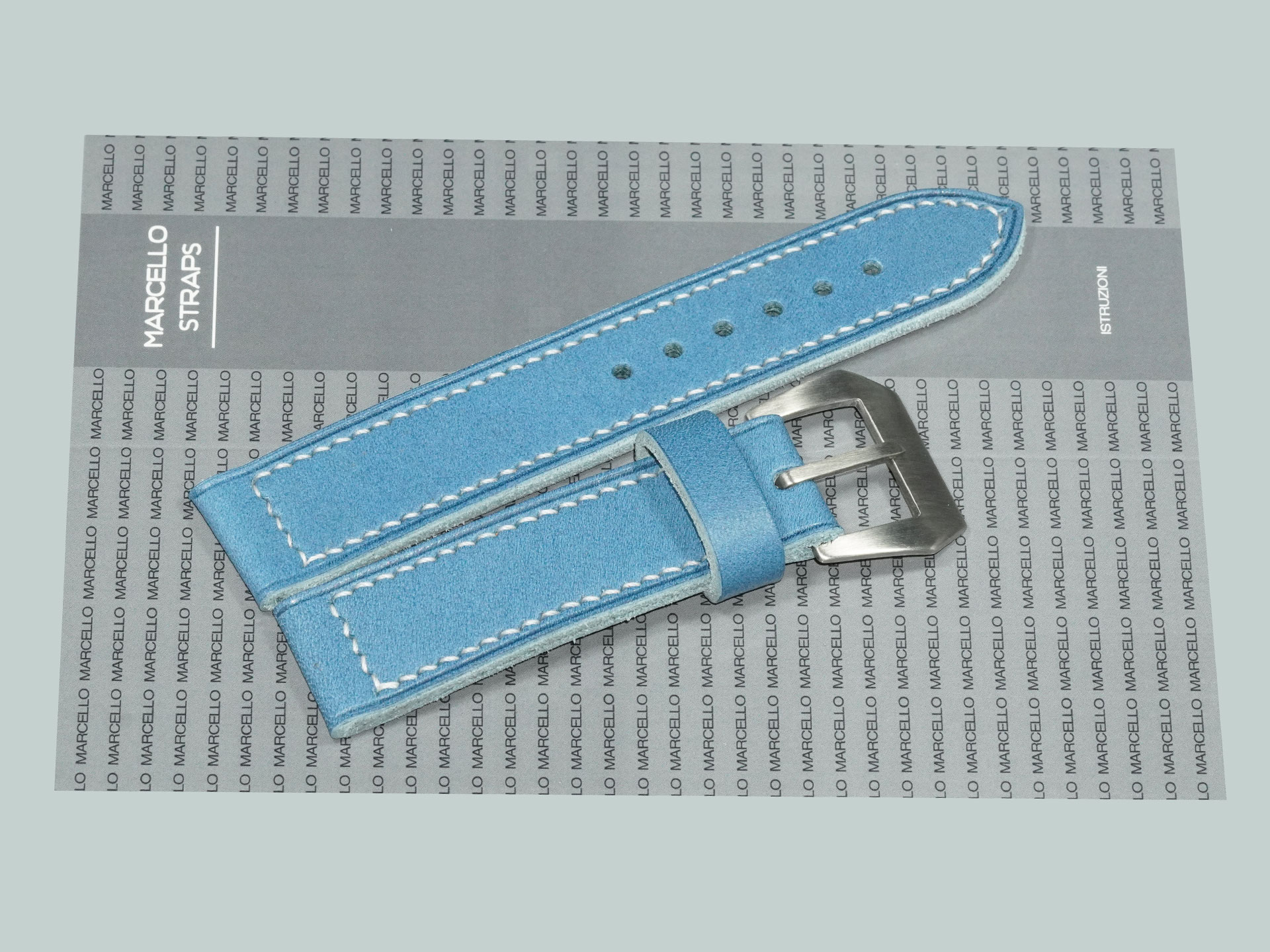 Blue Panerai strap with curved pre-V pin buckle sewn in place