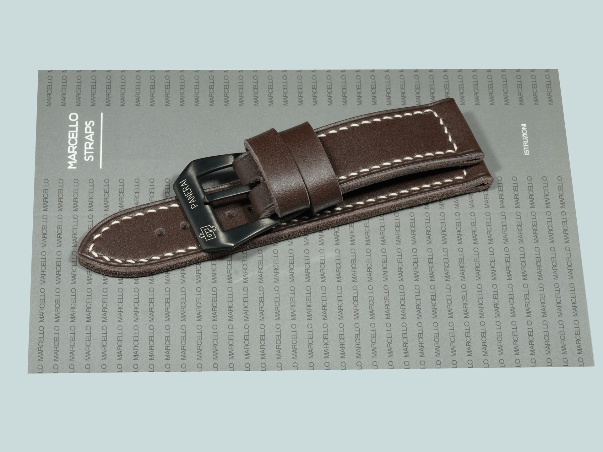 Dark Grey Panerai strap with black buckle on leather background