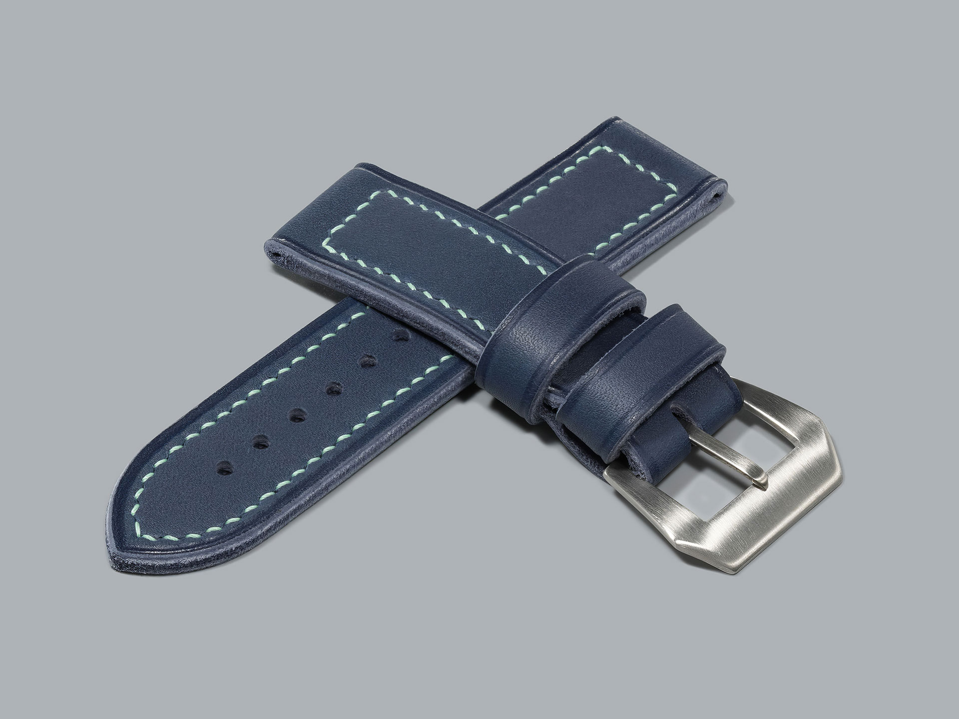 Blue Panerai strap attached to 44 mm Luminor watch case