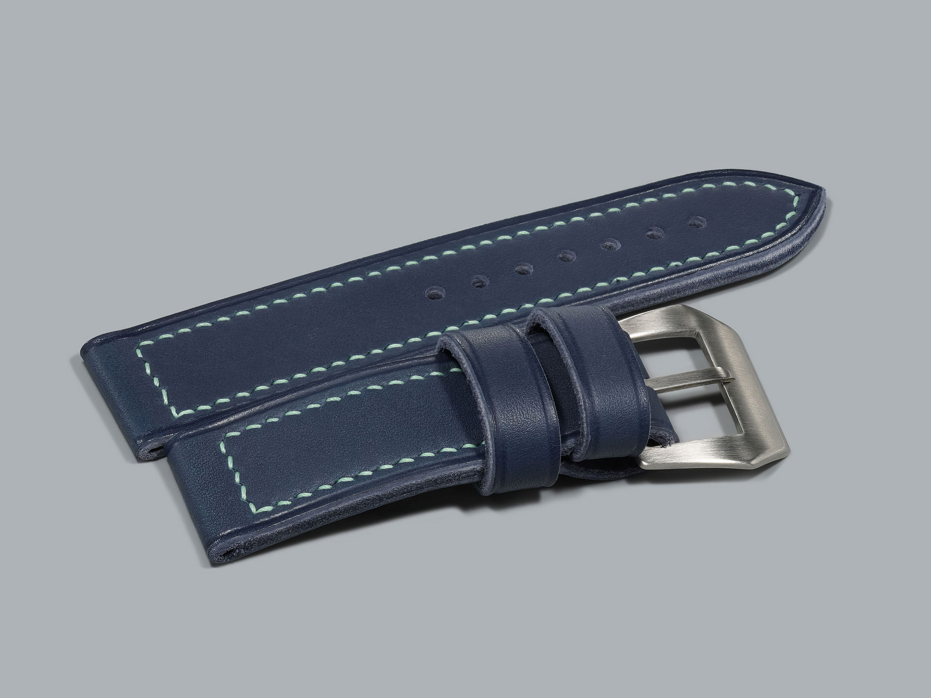Close-up of blue Panerai strap showing stitching detail and edge finish