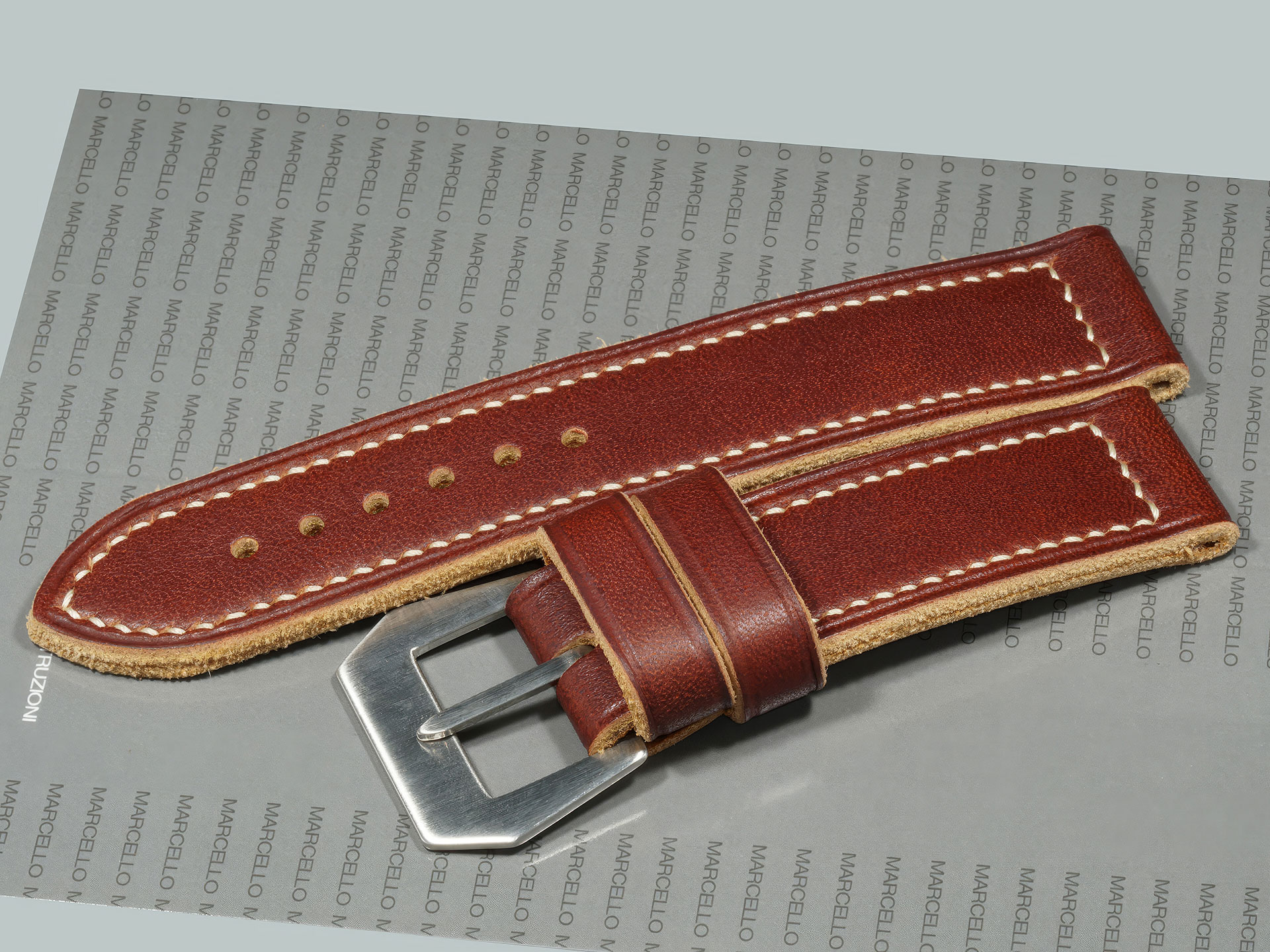 thick burgundy Panerai Luminor strap with burnished edges and boxed stitch