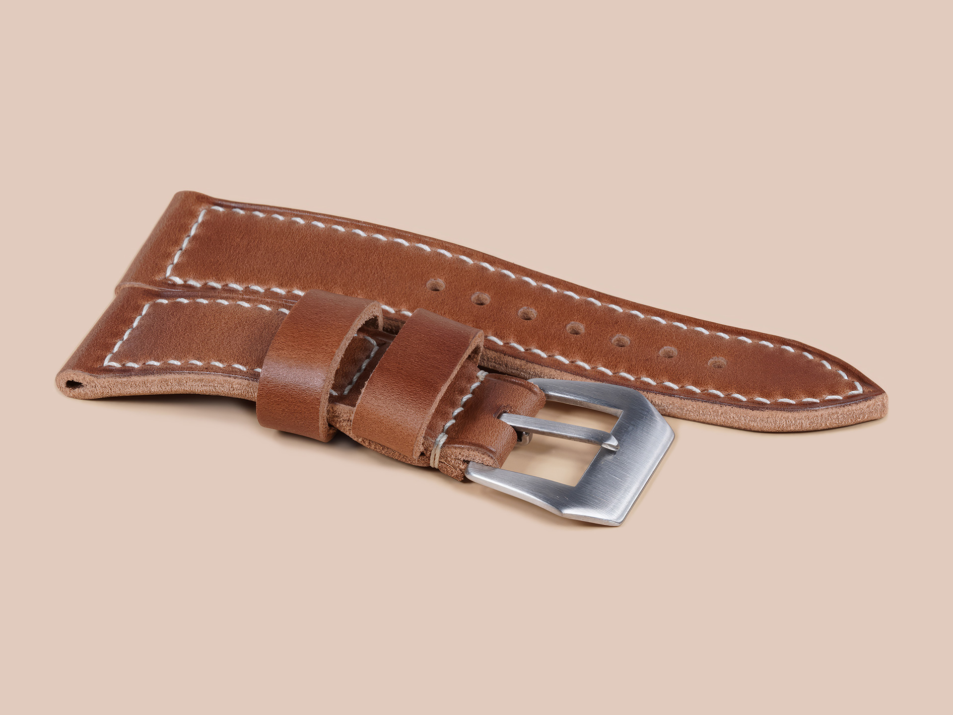 Close up of thick caramel brown Radiomir strap with vintage sewn buckle