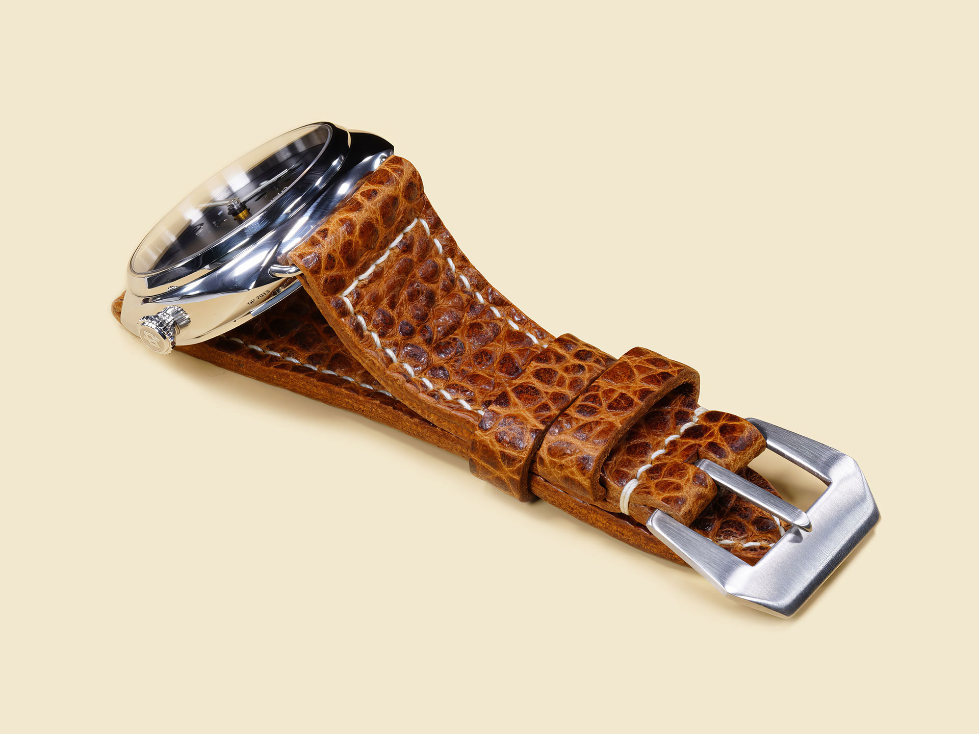 Close-up of brushed metal buckle on Panerai Radiomir leather strap.