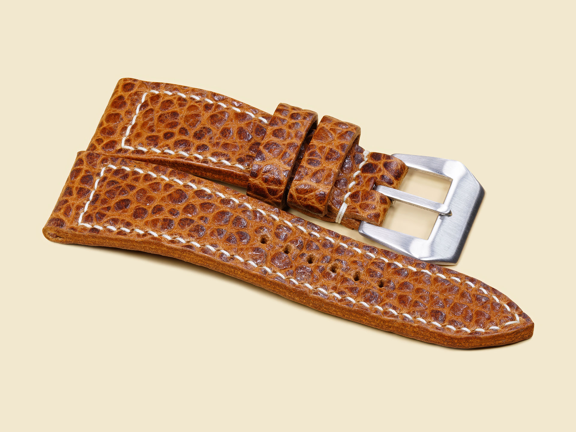 Close-up of pebbled texture on brown buffalo Panerai Radiomir strap.