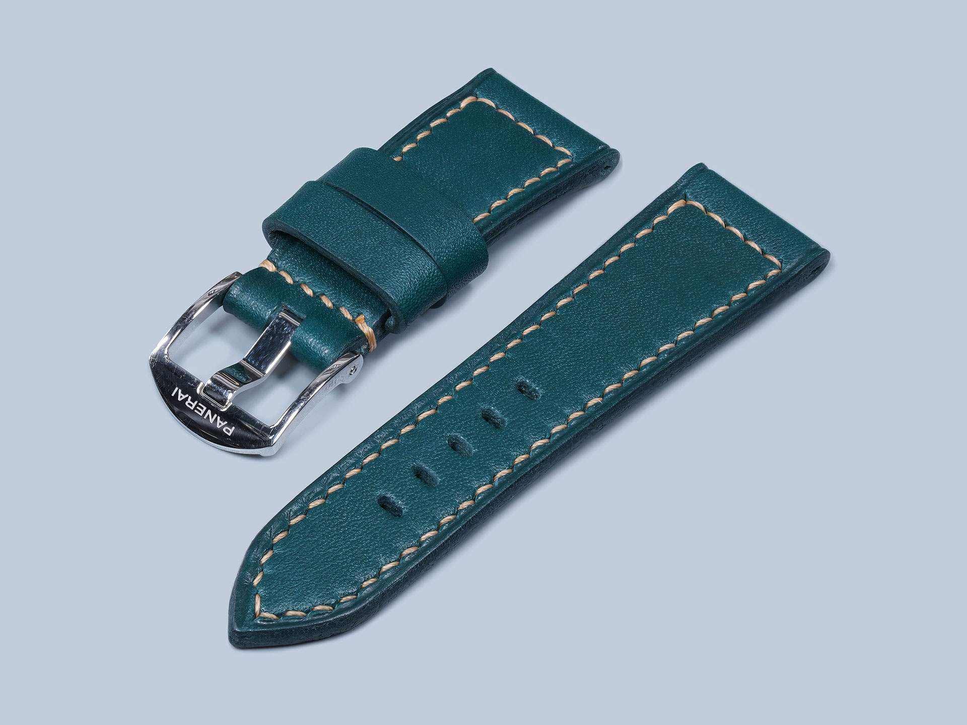 Dark teal handmade strap for the Panerai Due with beige stitching.