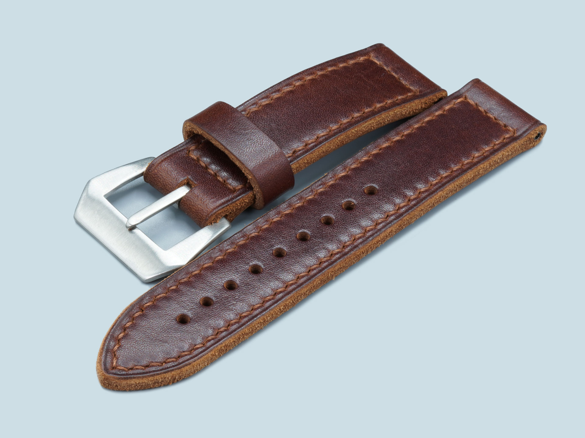 Hand-stitched-brown-leather-watch-band-with-integrated-sewn-in-buckle