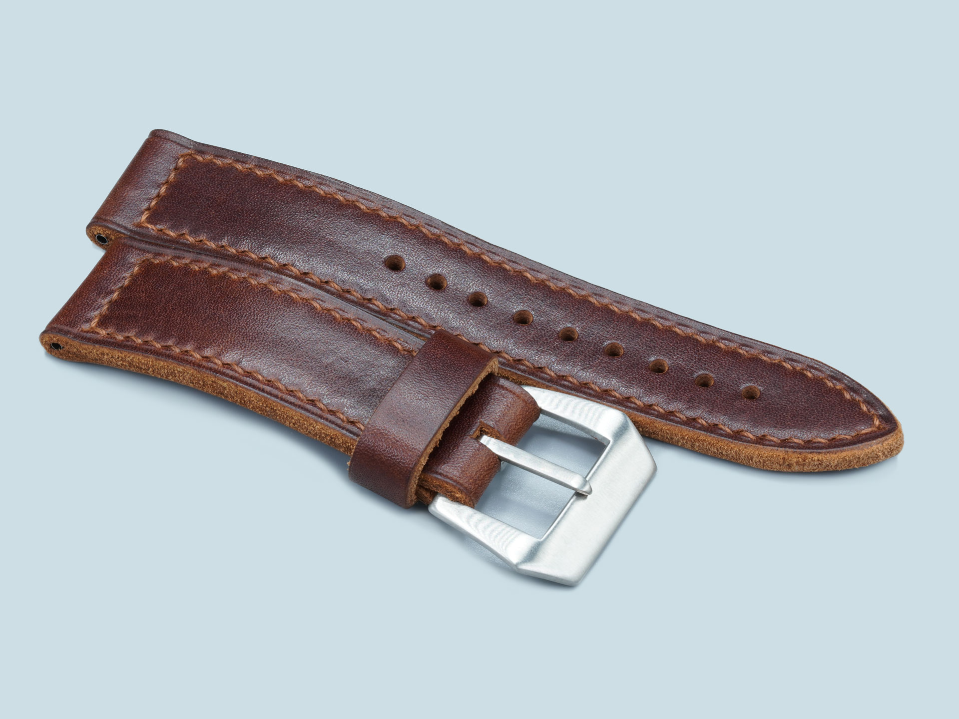 Custom-brown-leather-watch-strap-featuring-vintage-sewn-in-pre-v-buckle