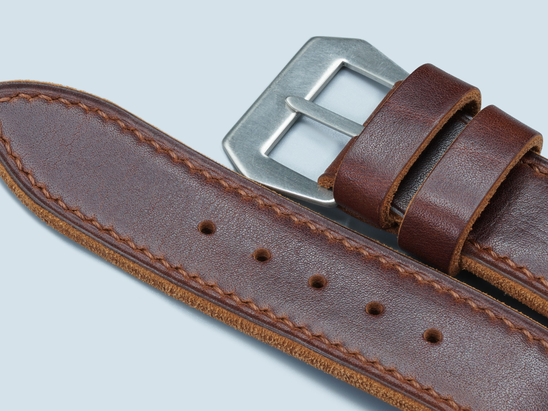 Close-up of heavy-duty brown stitching on 4.5mm leather.