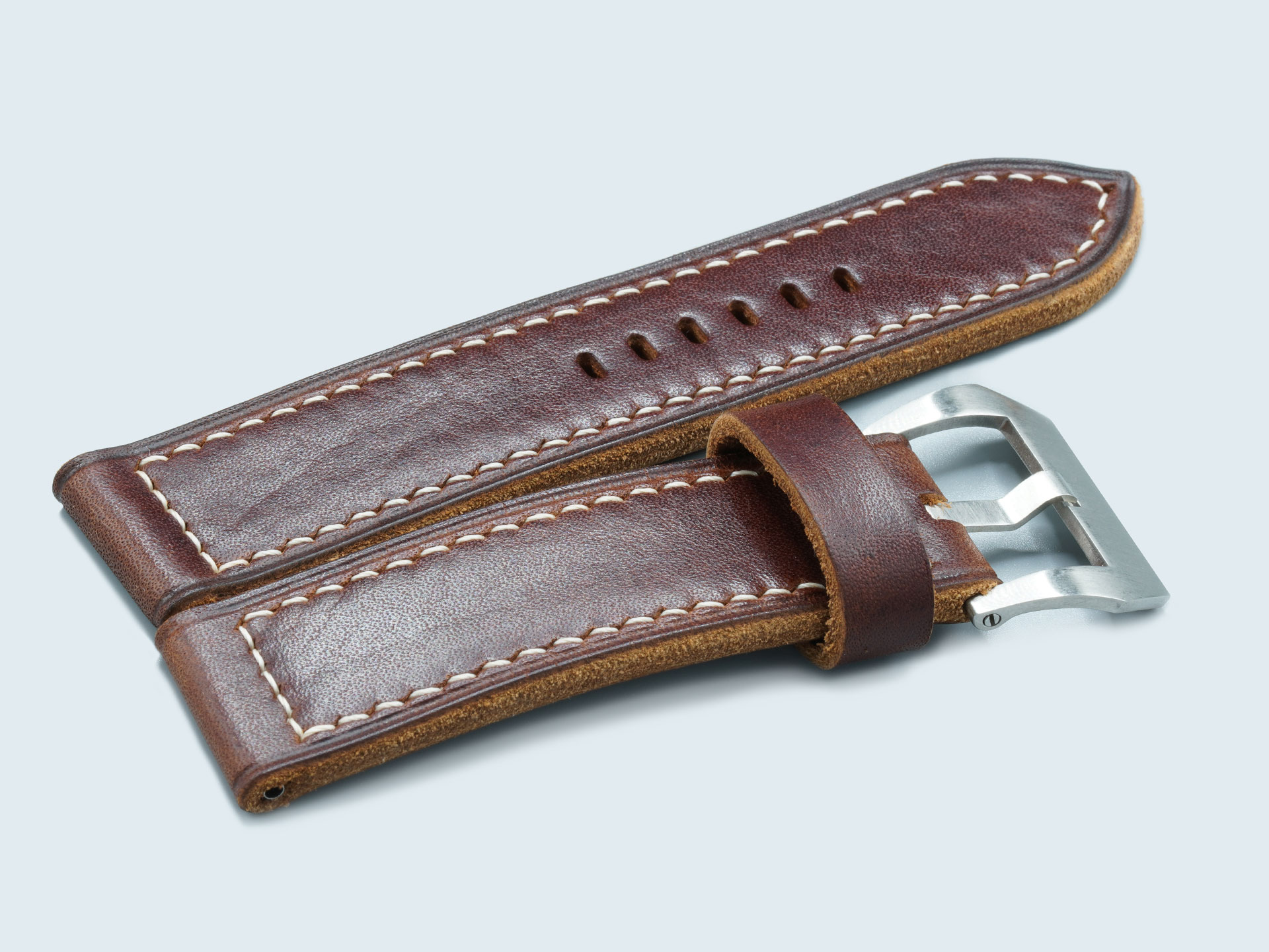 Raw edge detail on handcrafted dark walnut Panerai strap