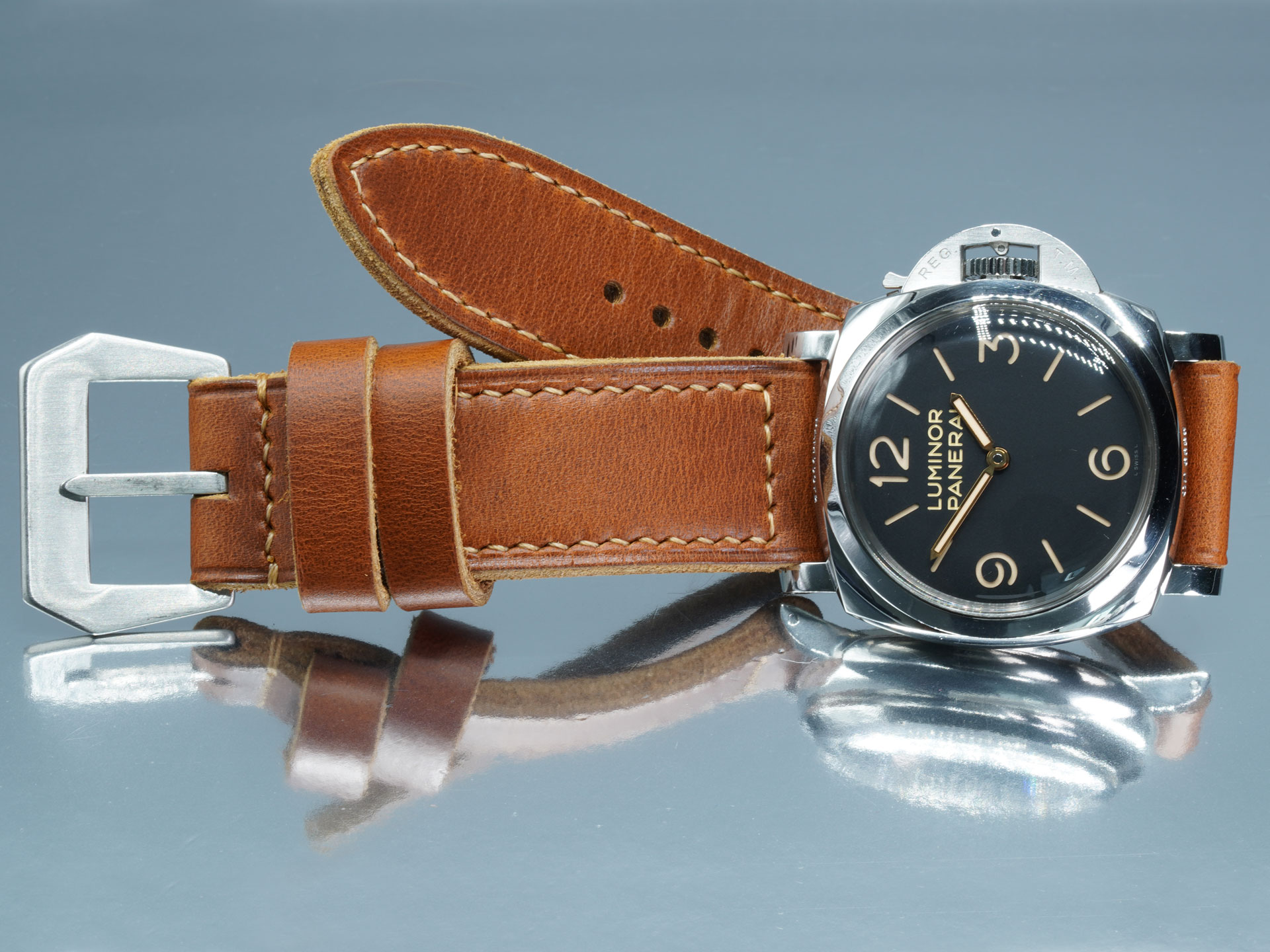 Edge stitching detail on a vintage tan leather Panerai strap with flat buckle