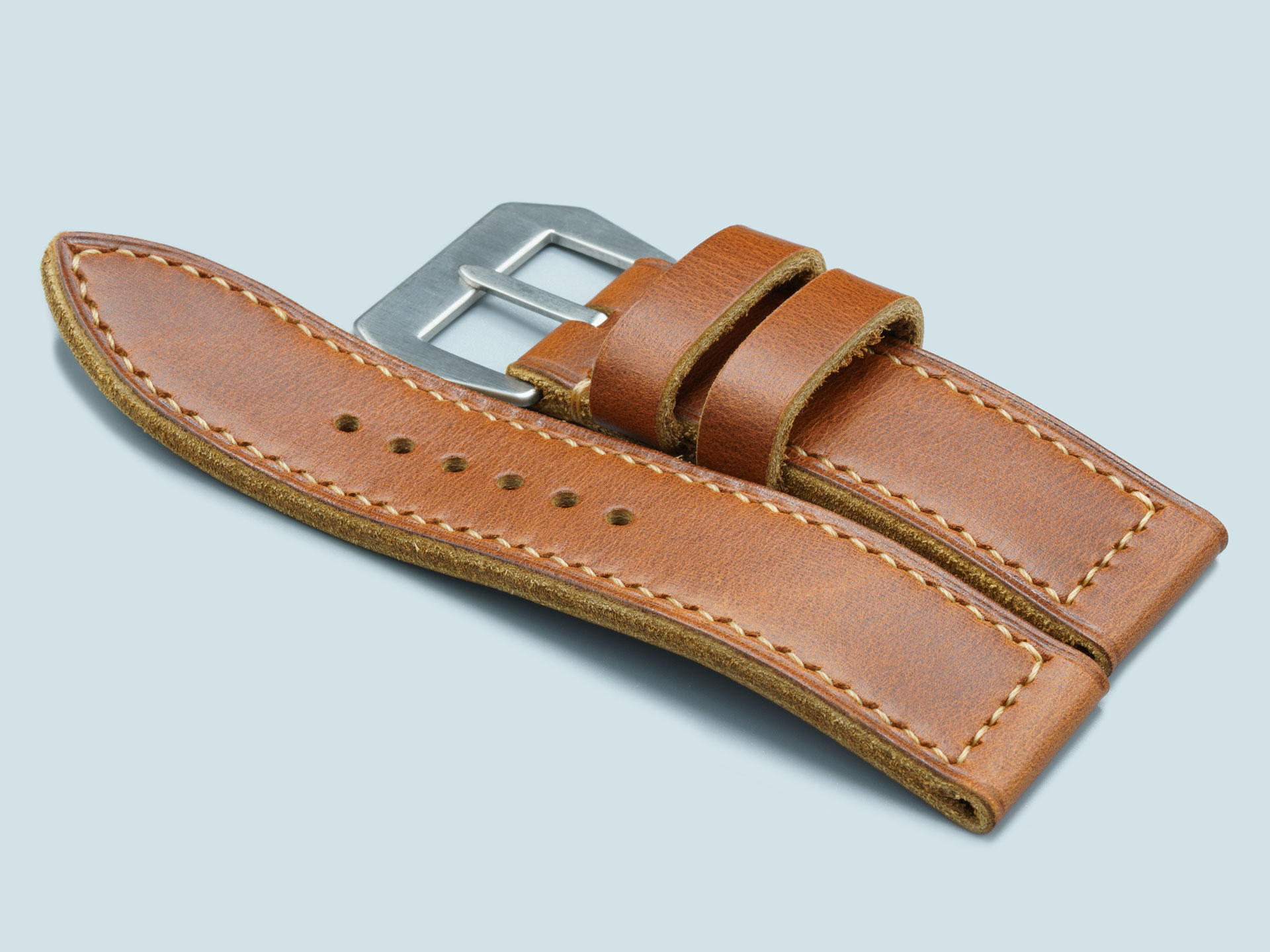 Torpedo tip detail on this vintage tan Panerai leather strap, handcrafted with a flat buckle