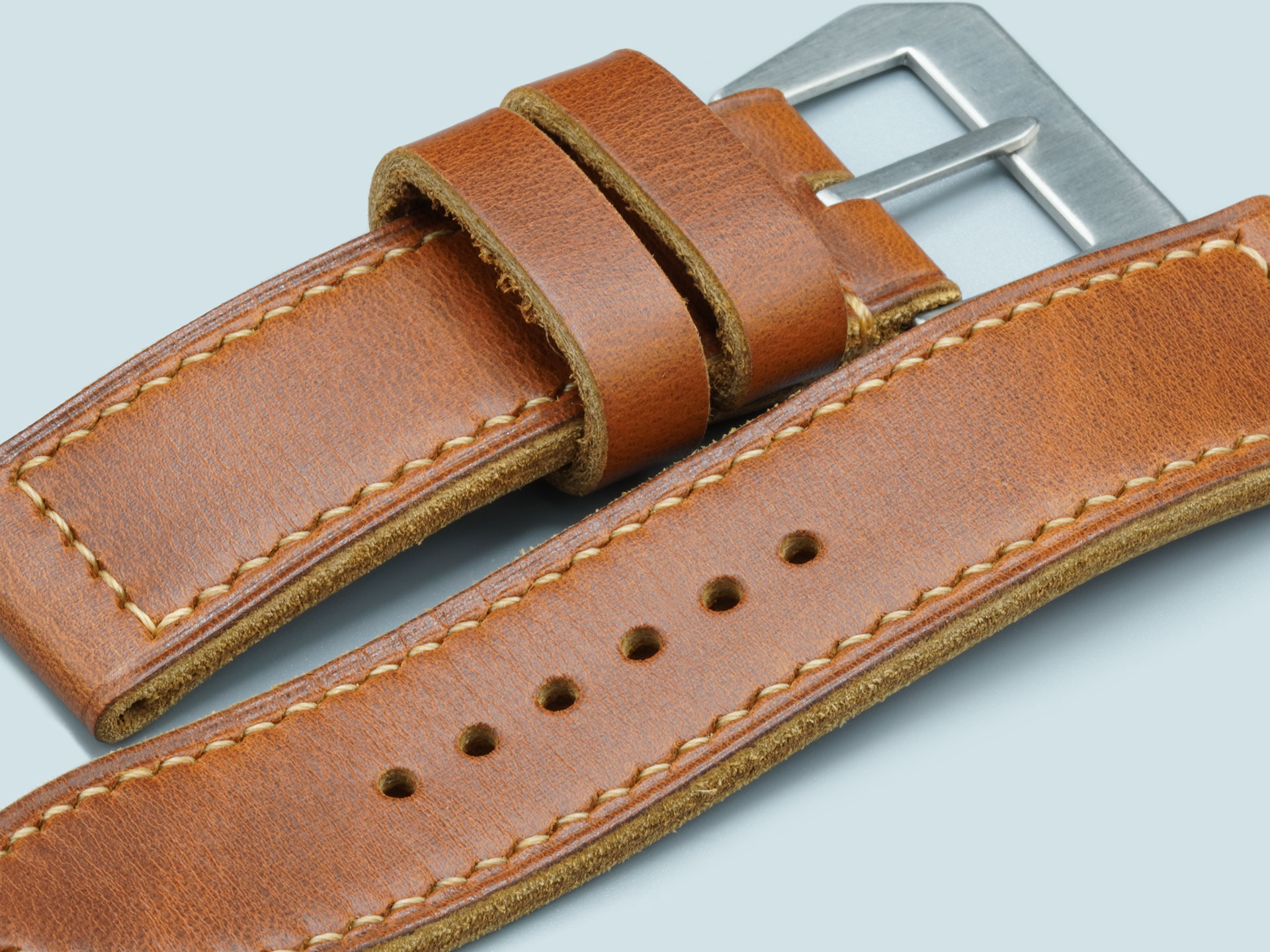 Vintage flat buckle paired with tan leather on this handcrafted 47mm Panerai strap