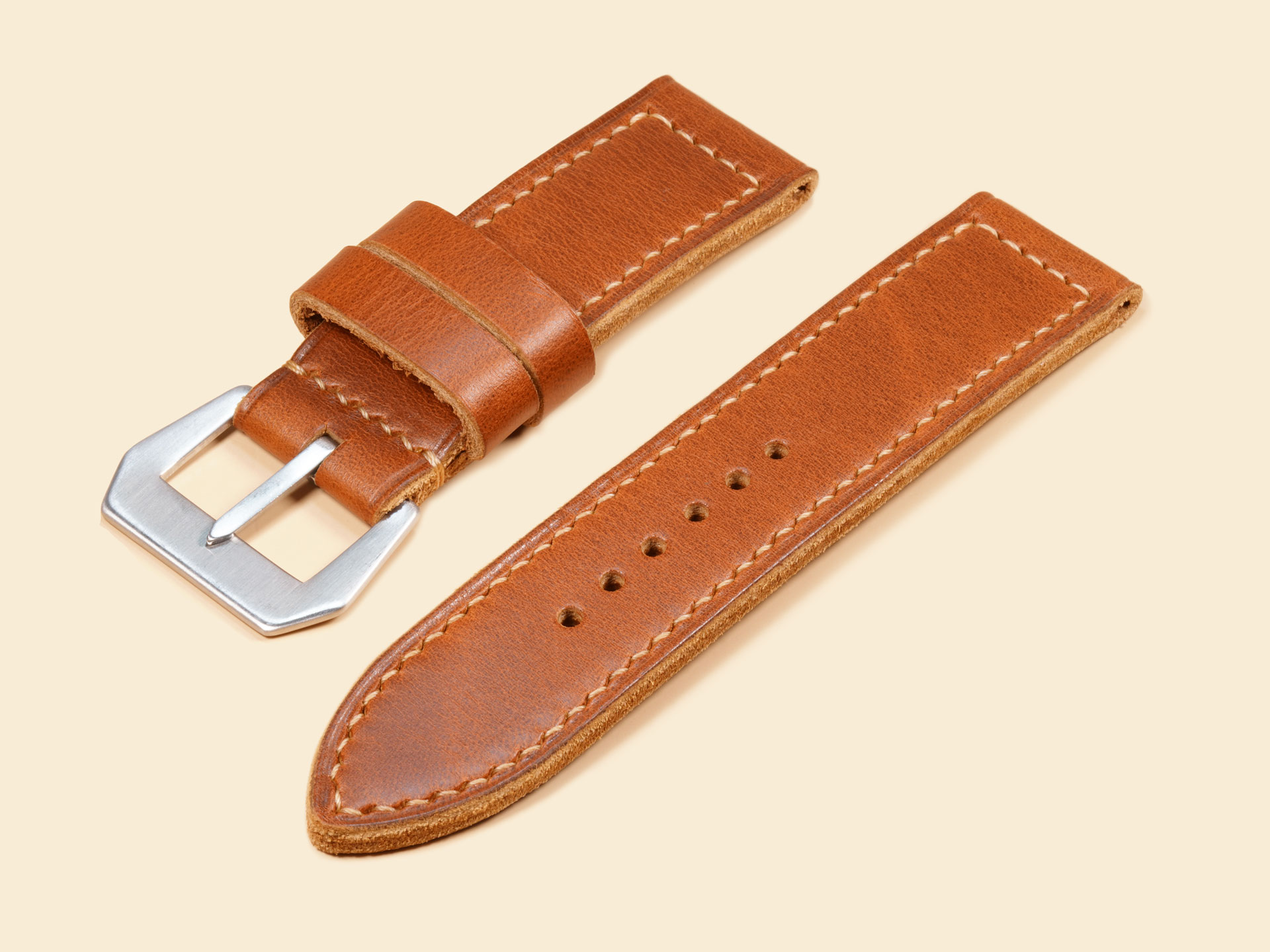 Heavy-duty 26mm tan leather strap with a flat GPF-style buckle on a 47mm Panerai watch.