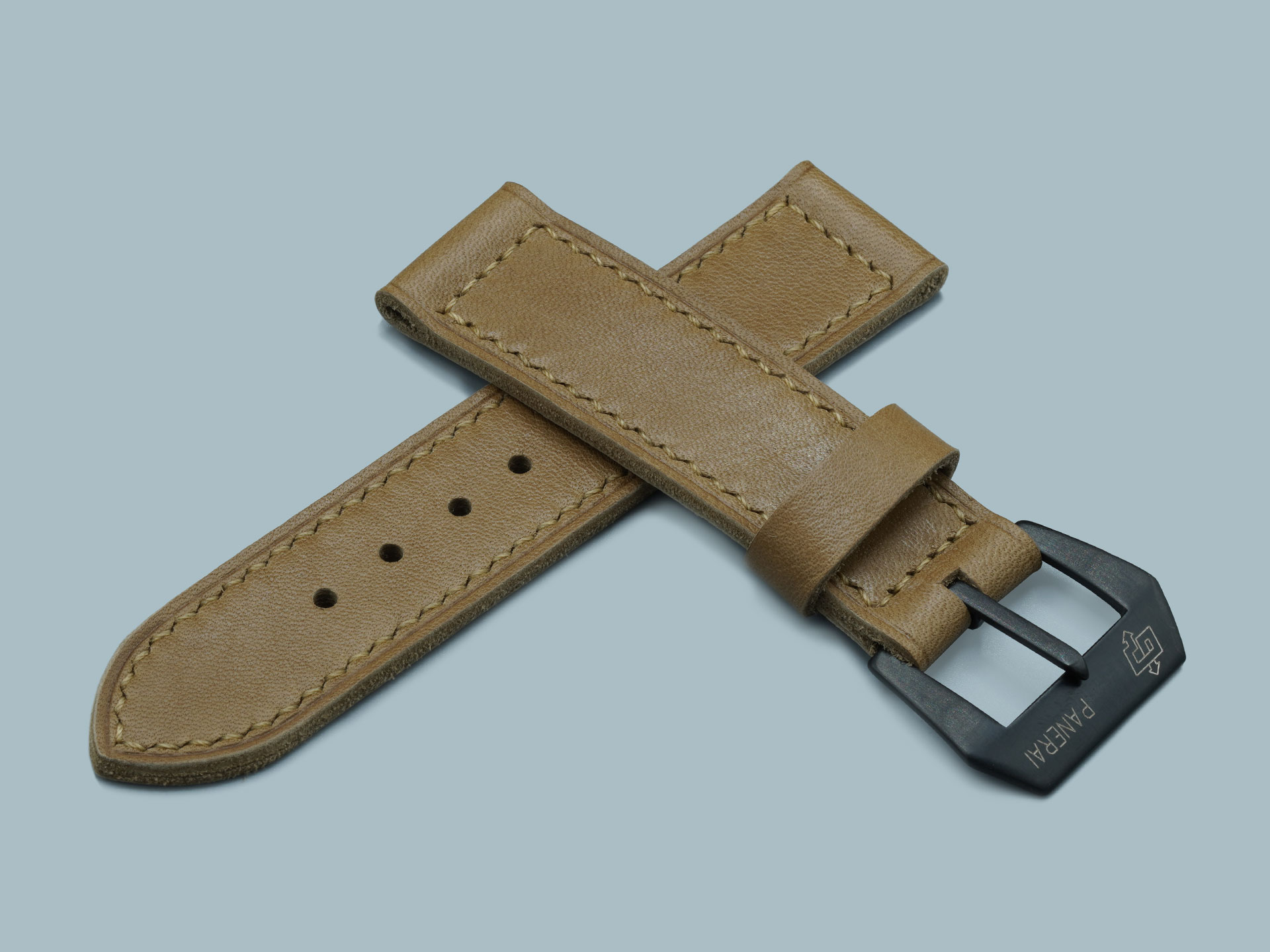 Tan leather strap with vintage styling, buckle end detail