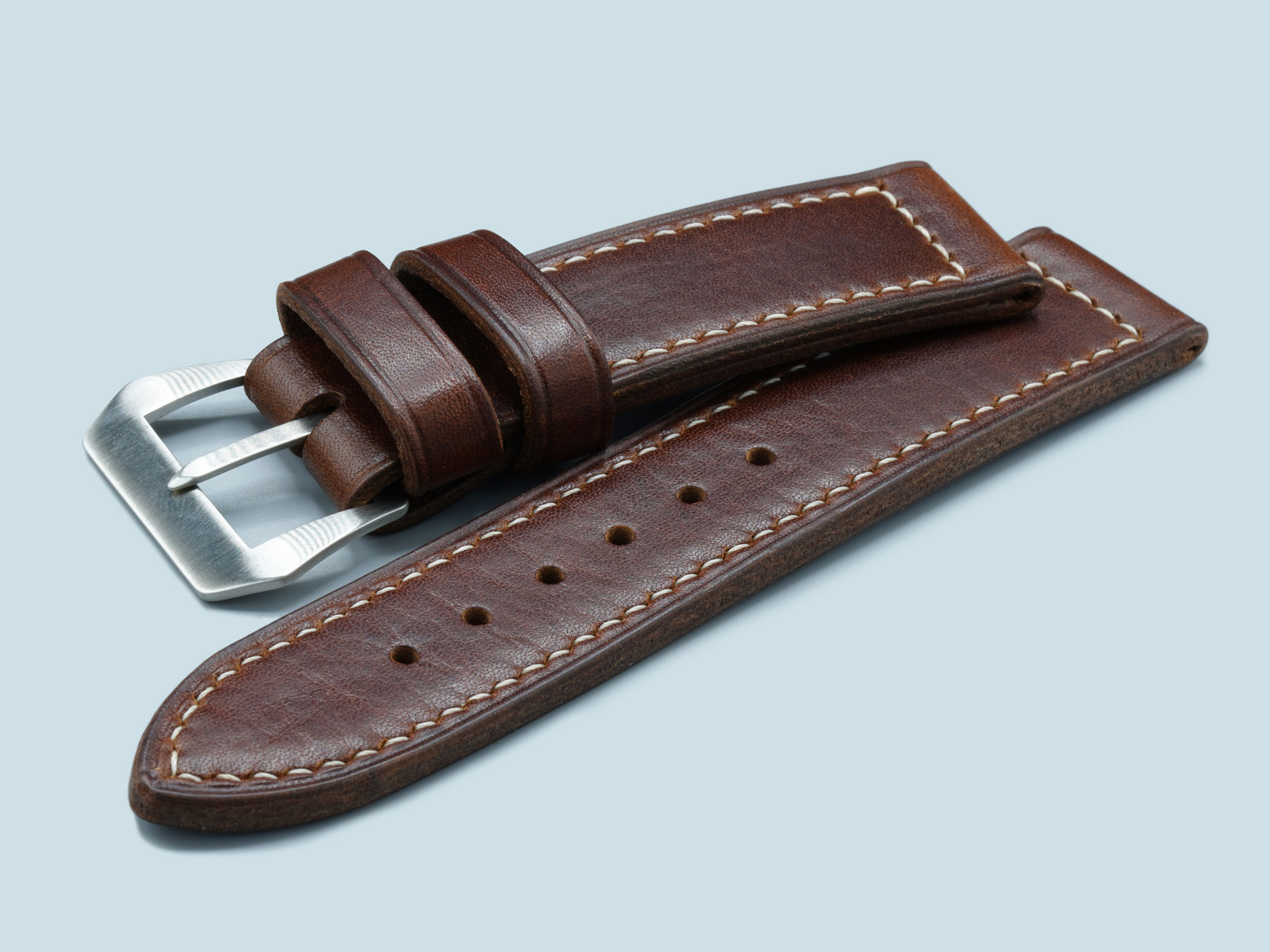 Lug end close-up of a handcrafted dark brown Panerai Luminor strap