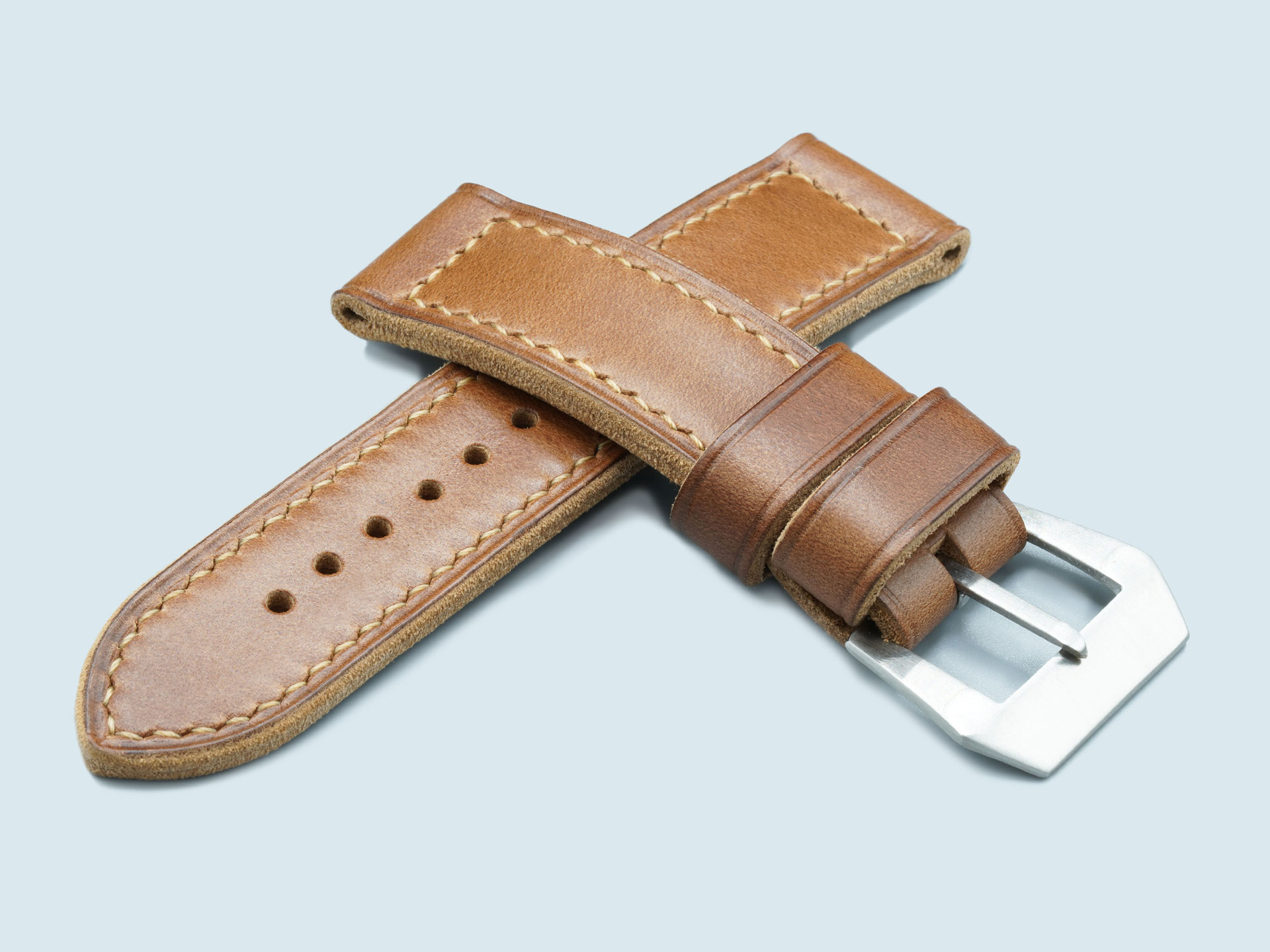 Lug end of a handcrafted caramel brown leather strap sized for 44mm Panerai Luminor