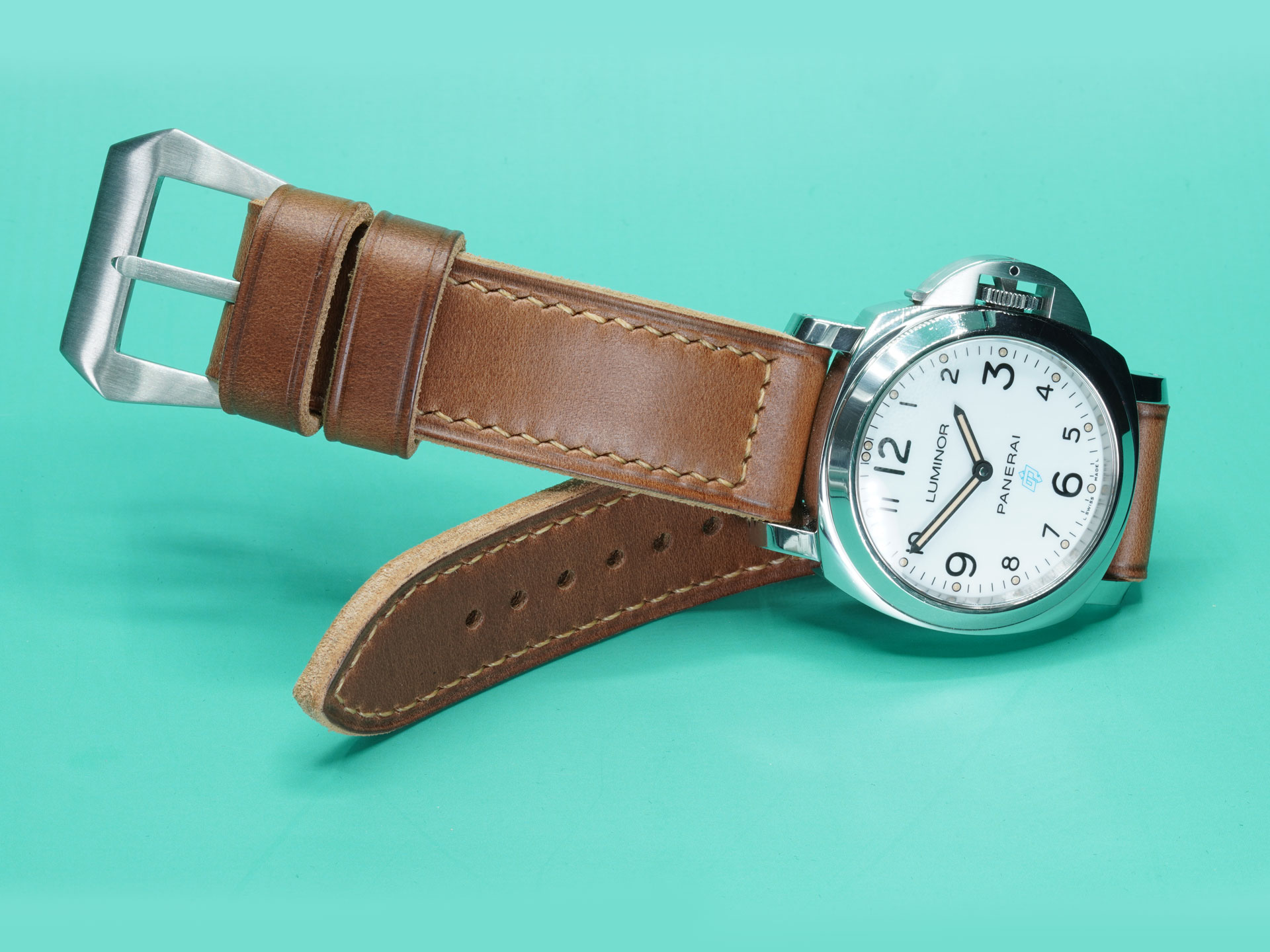 Full length flat lay of a thick caramel brown handcrafted Panerai Luminor strap