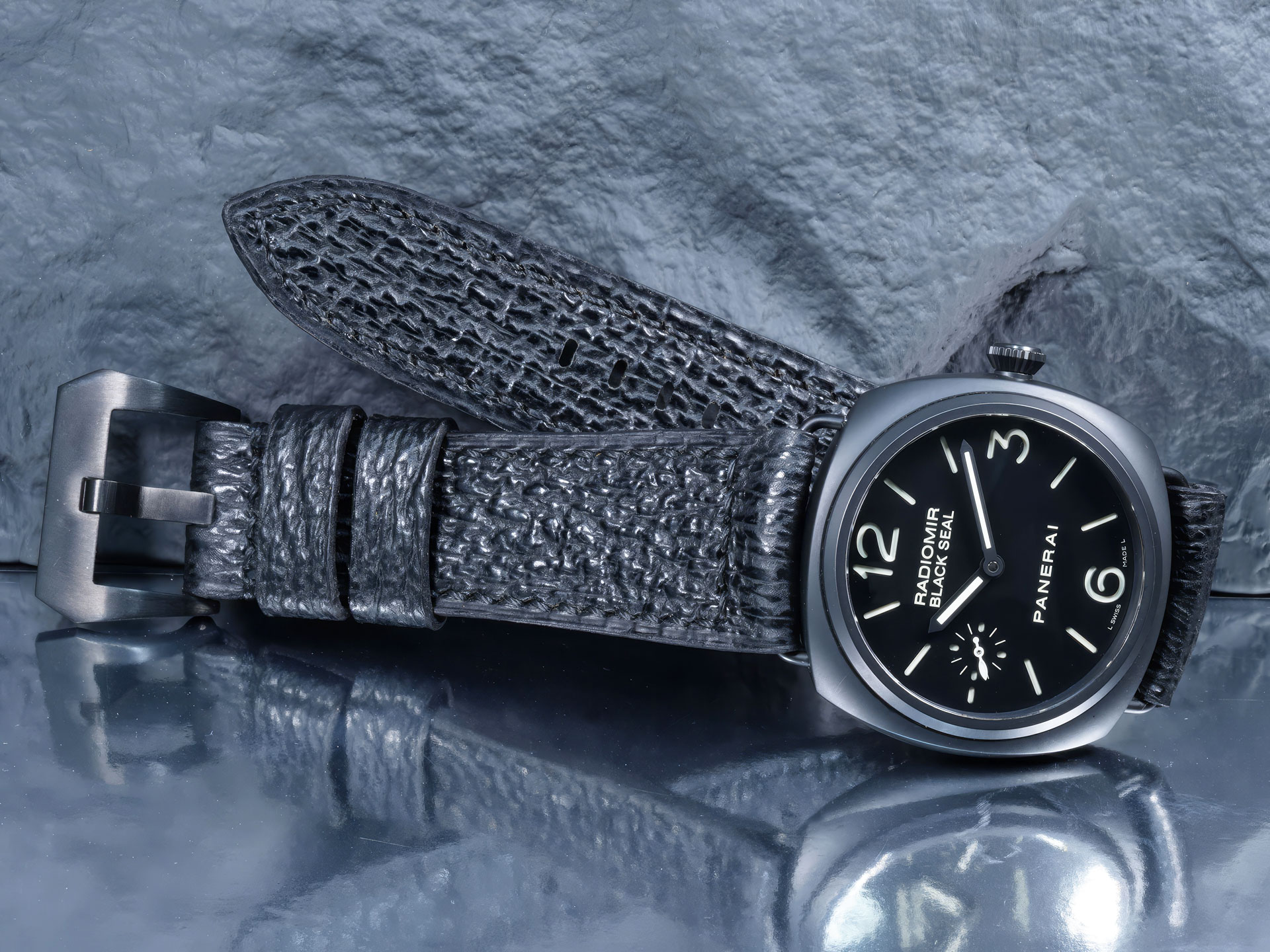 Macro detail of the hand-aligned black stitching on a Squalo Nero Panerai Radiomir strap.