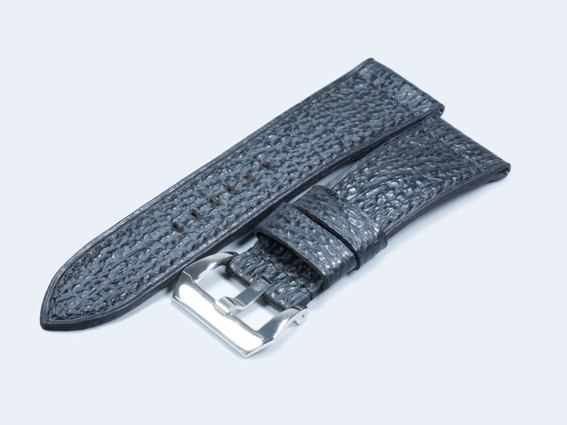 Handcrafted black shark skin watch strap with matching black stitching on a Panerai Radiomir.