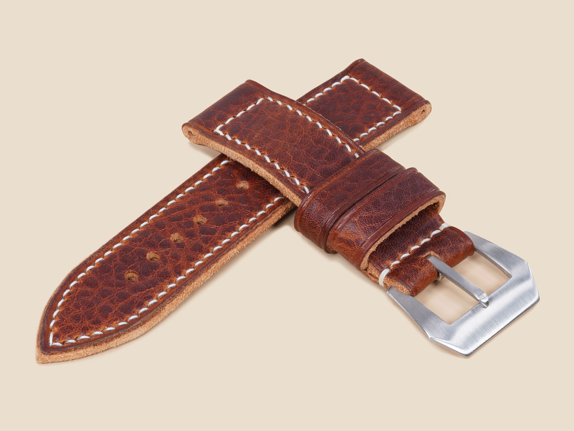 Close-up of buckle hardware on a handmade textured brown strap for Panerai 44mm