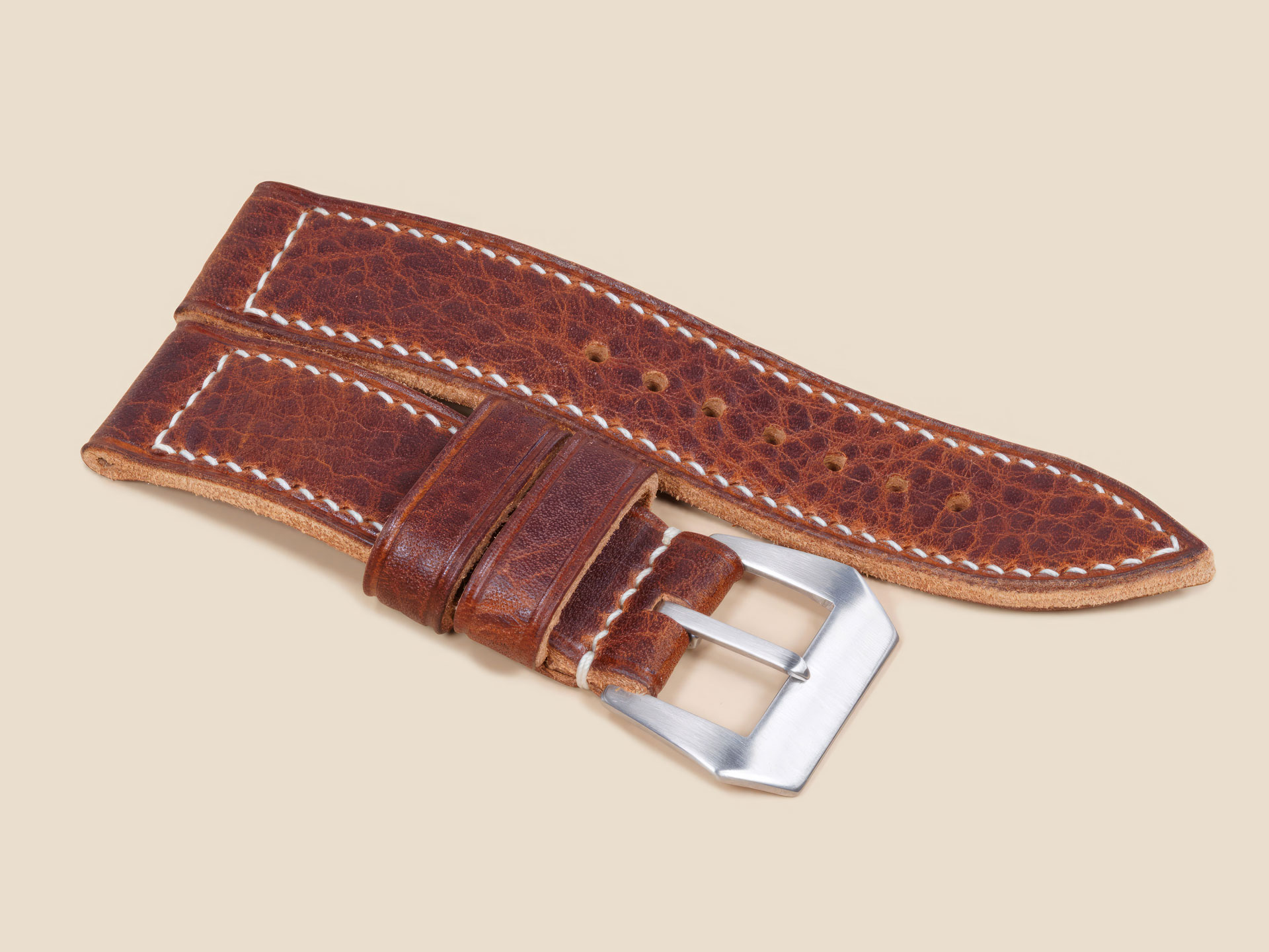 Handmade textured brown Panerai strap worn on the wrist, 44mm case fit