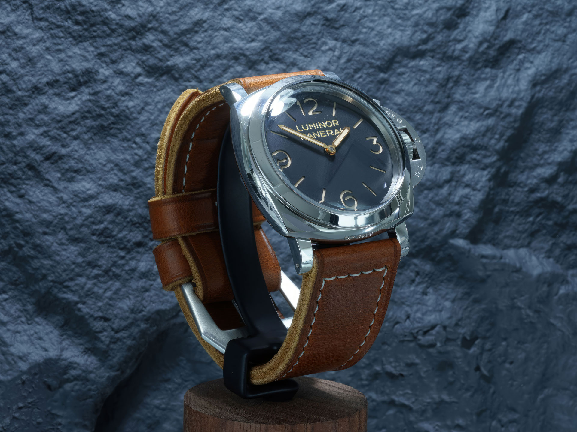 Vintage-inspired tan leather strap laid flat with an iconic wide GPF buckle.