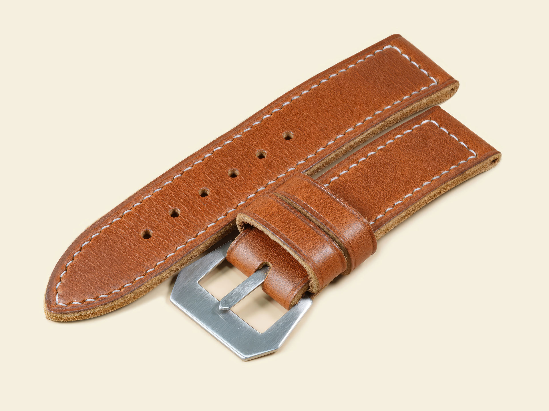 Custom 47mm Panerai Luminor strap in vintage tan leather featuring beige hand-stitching.