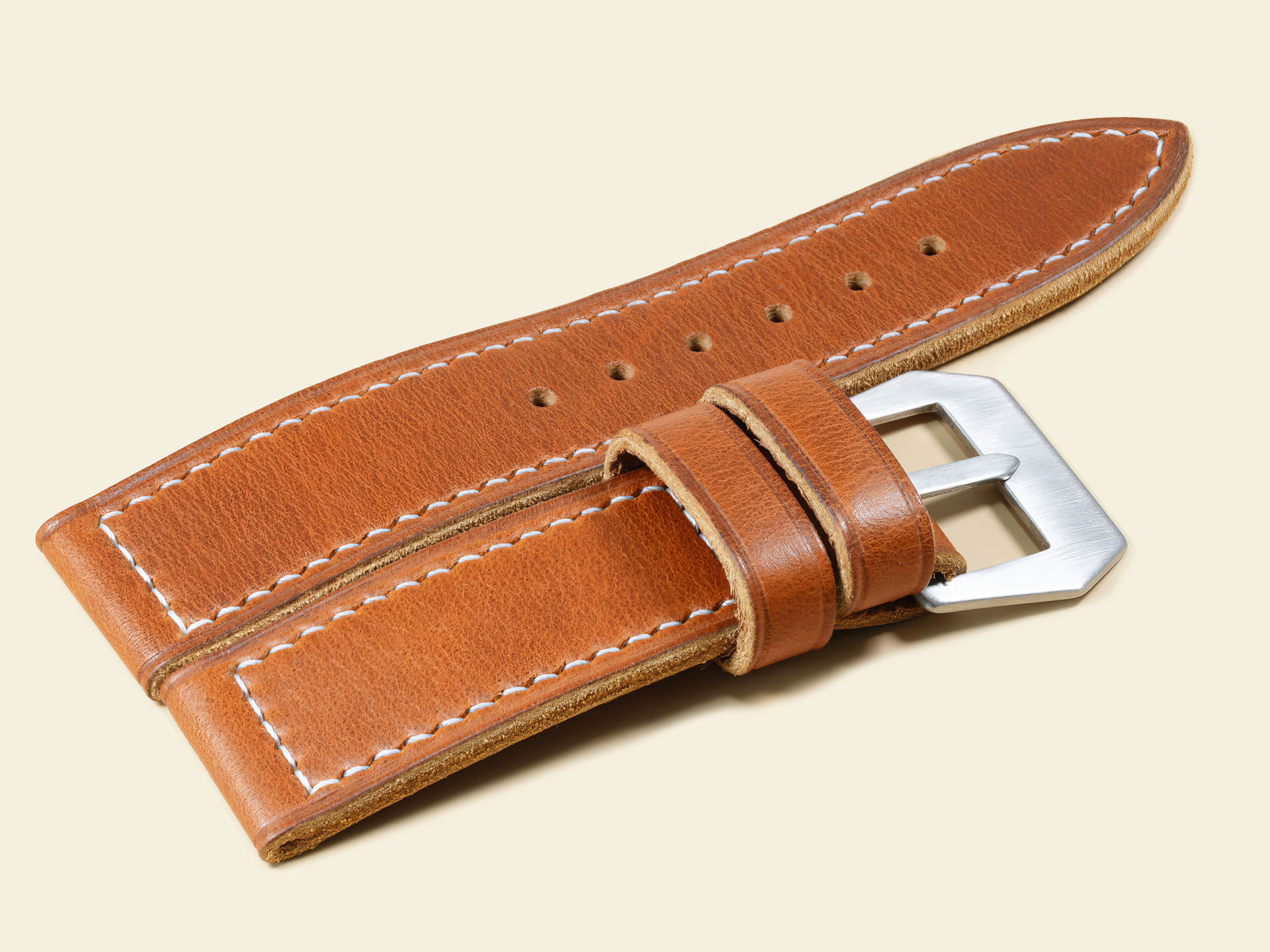 Close-up of a premium tan leather strap handcrafted for 47mm Panerai Luminor models.