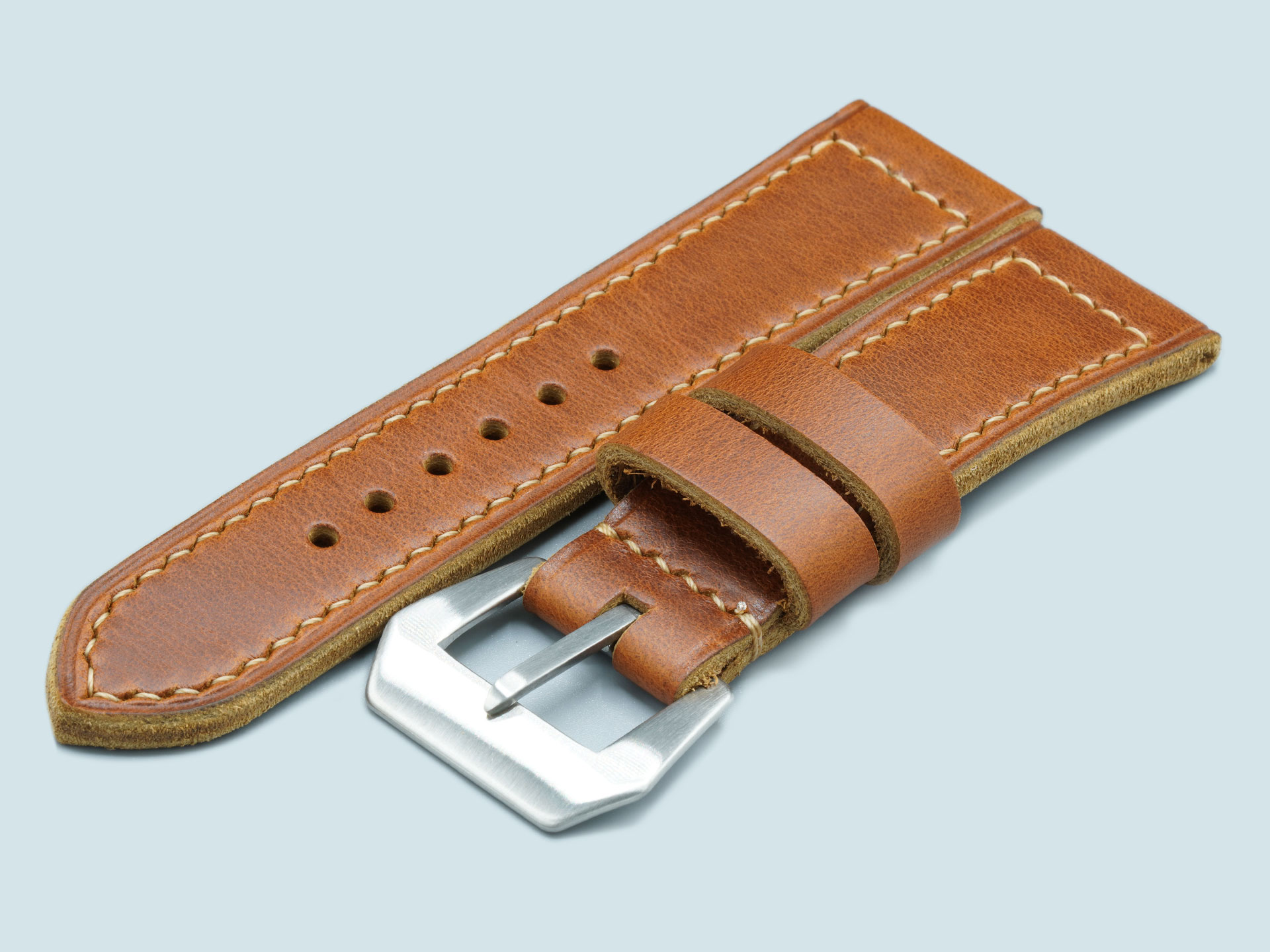 Handcrafted by Marcello Straps, this tan Radiomir strap features a sewn vintage style pin buckle
