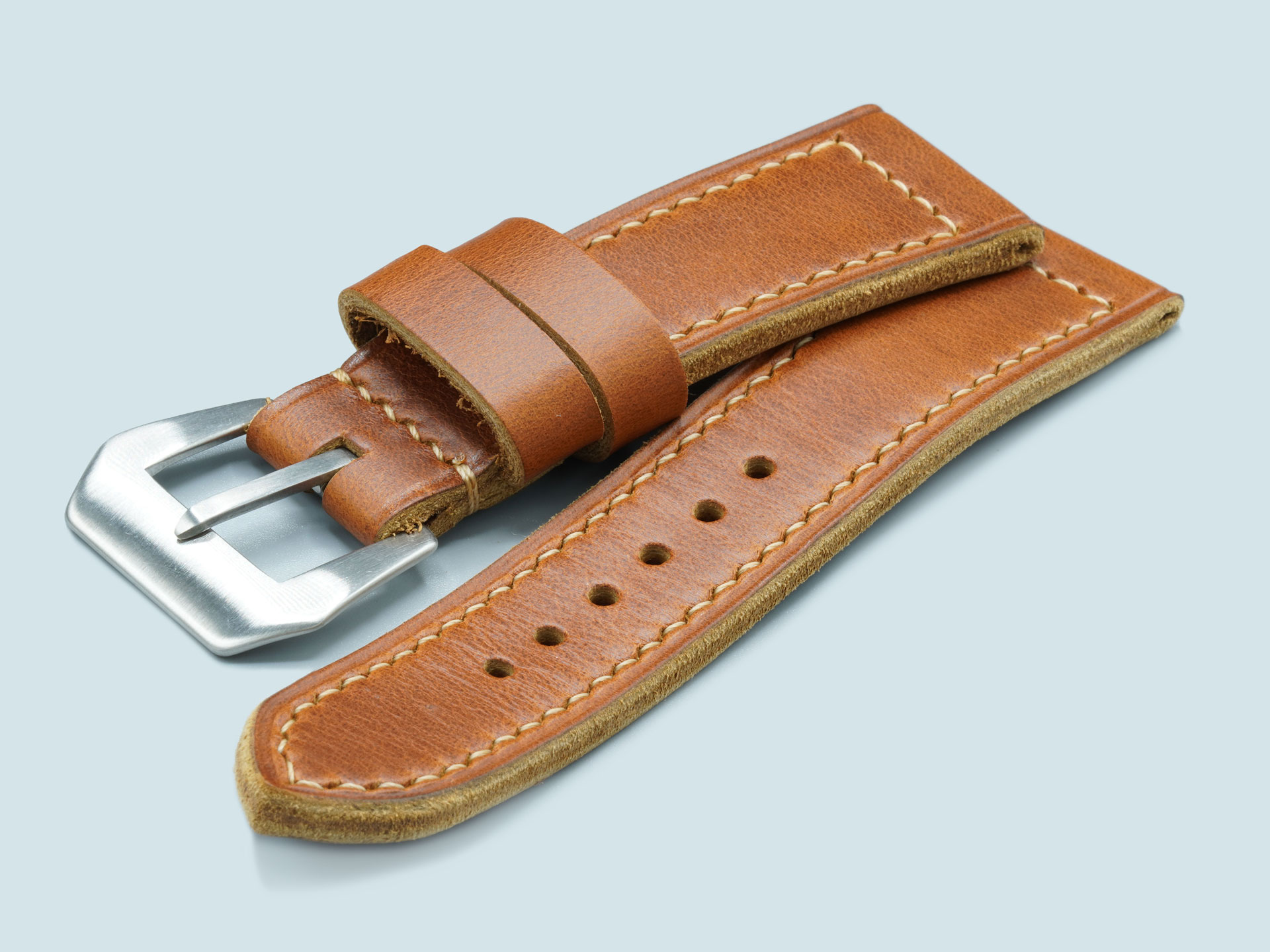 Marcello Straps' classic tan Radiomir strap, angled to show taper and stitching