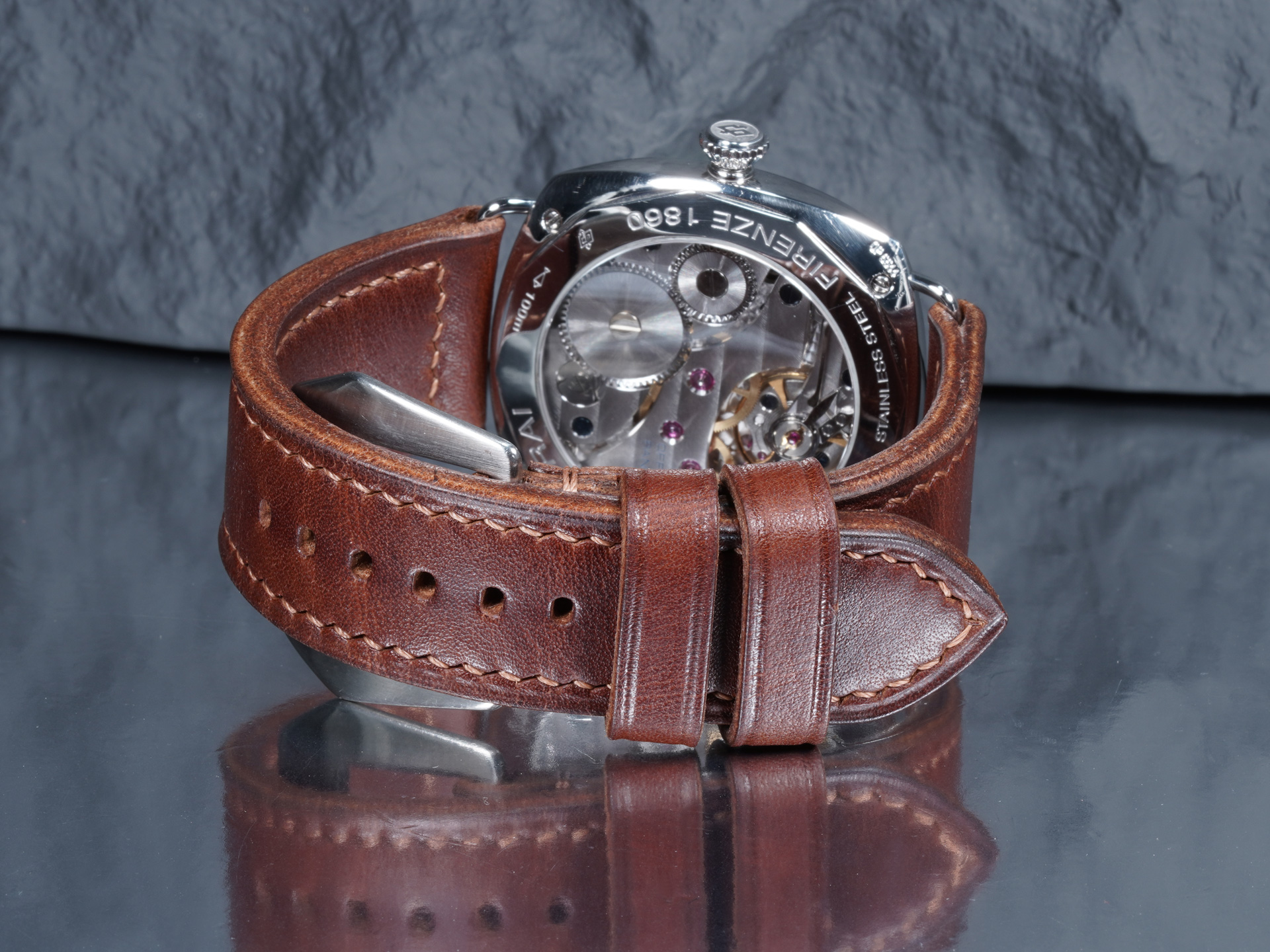 Tapered dark walnut brown leather strap attached to Panerai PAM00183 Black Seal wire lugs.