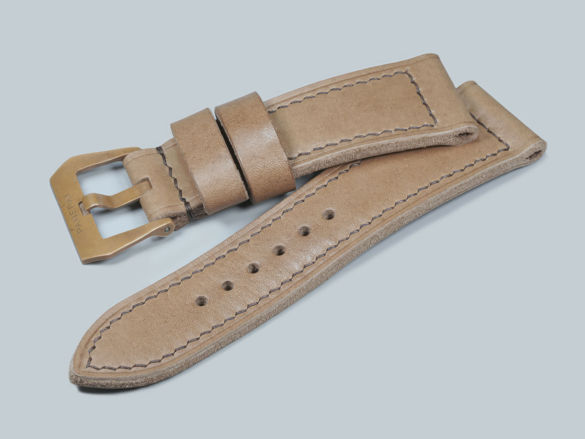 Profile view showing thickness of a custom Panerai Bronzo strap for PAM00968, handmade.