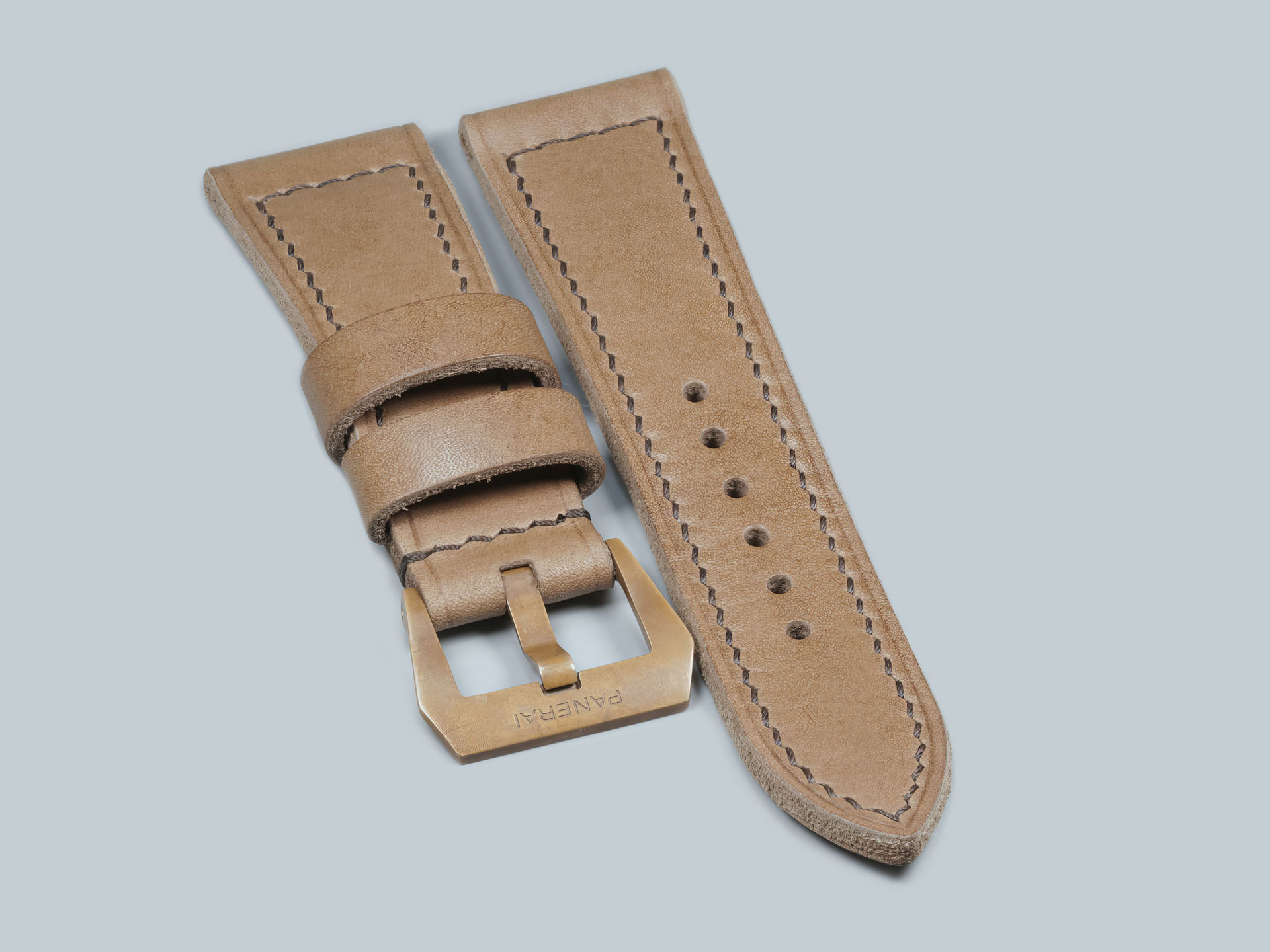 Floating leather keeper on a custom Panerai Bronzo strap for PAM00968, handmade in Italy.