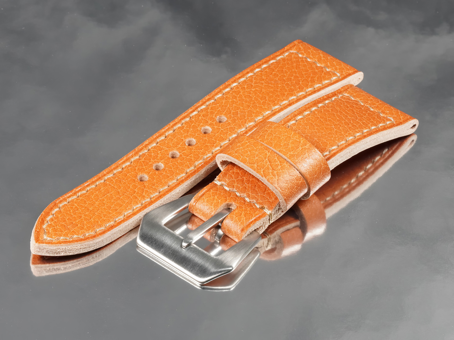 Macro view of hand-stitched linen thread on tan custom Panerai Radiomir strap from Marcello Straps