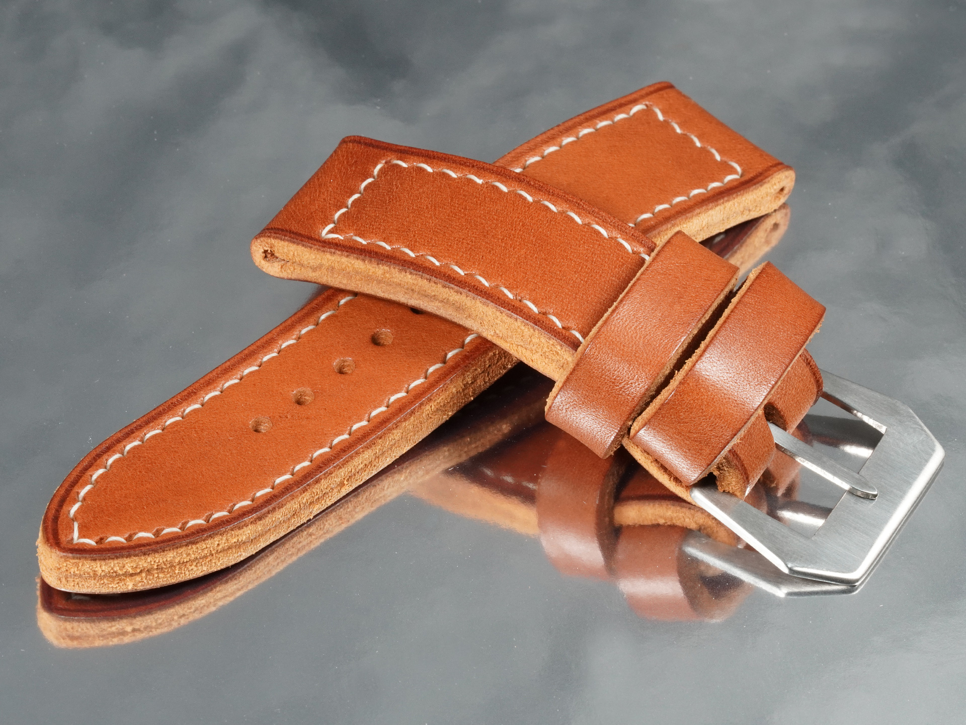 Hand-burnished beeswax edge finishing along a custom 5mm thick Panerai strap lug connection
