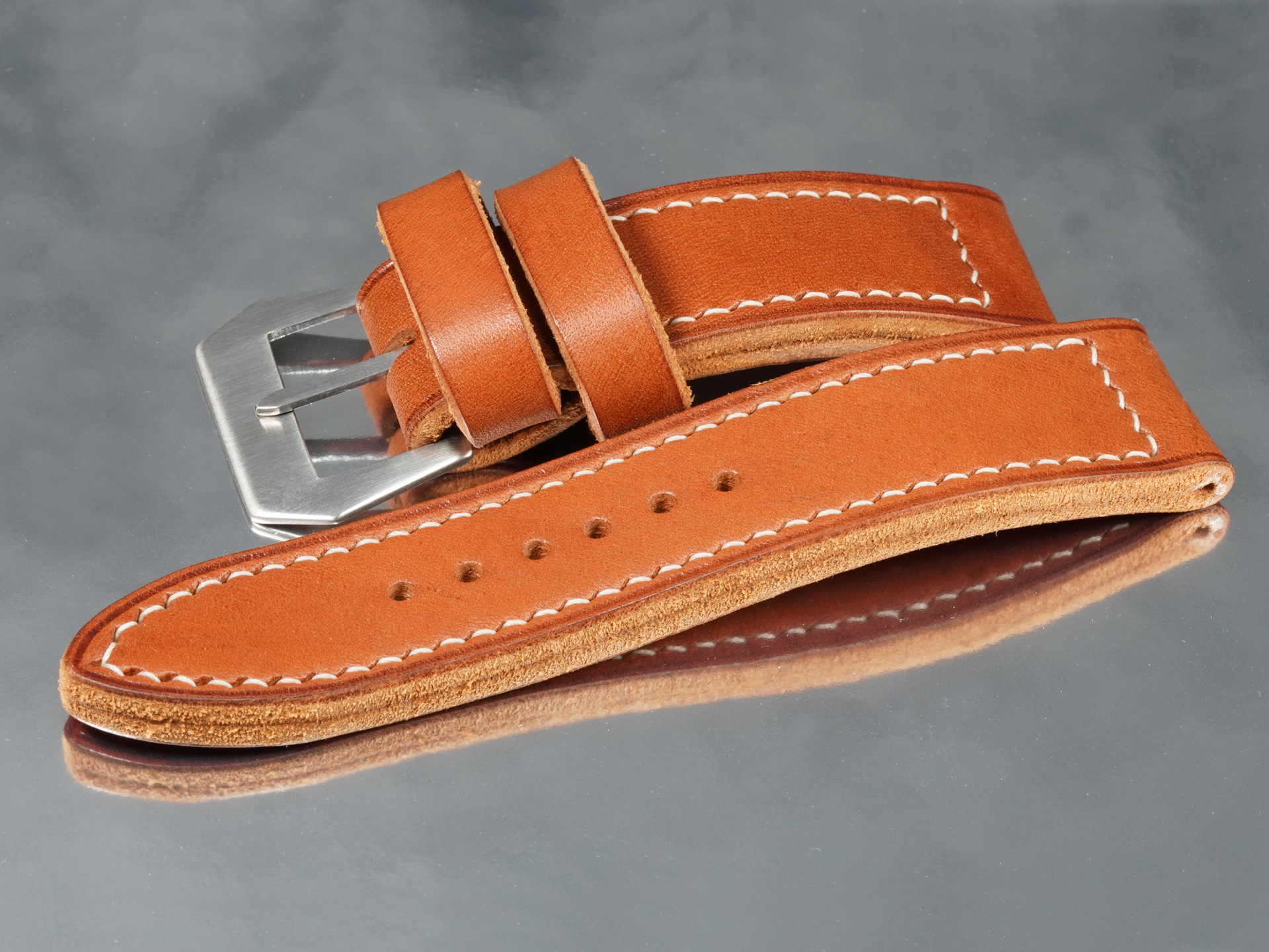 Hand-punched pin holes aligned with vintage flat tang on a GPF-56 handmade Panerai strap