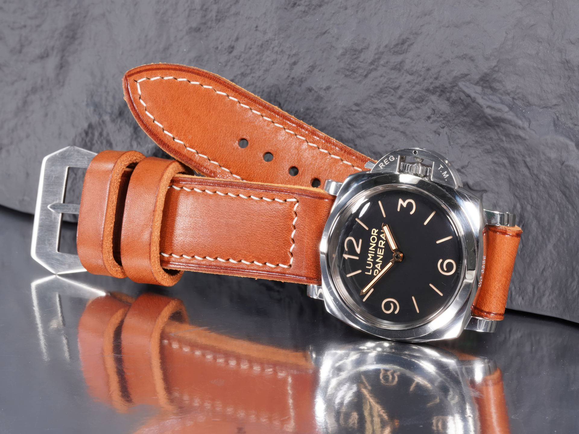 Hand-creased border line on a 6.4mm super thick Panerai strap in natural tan leather.