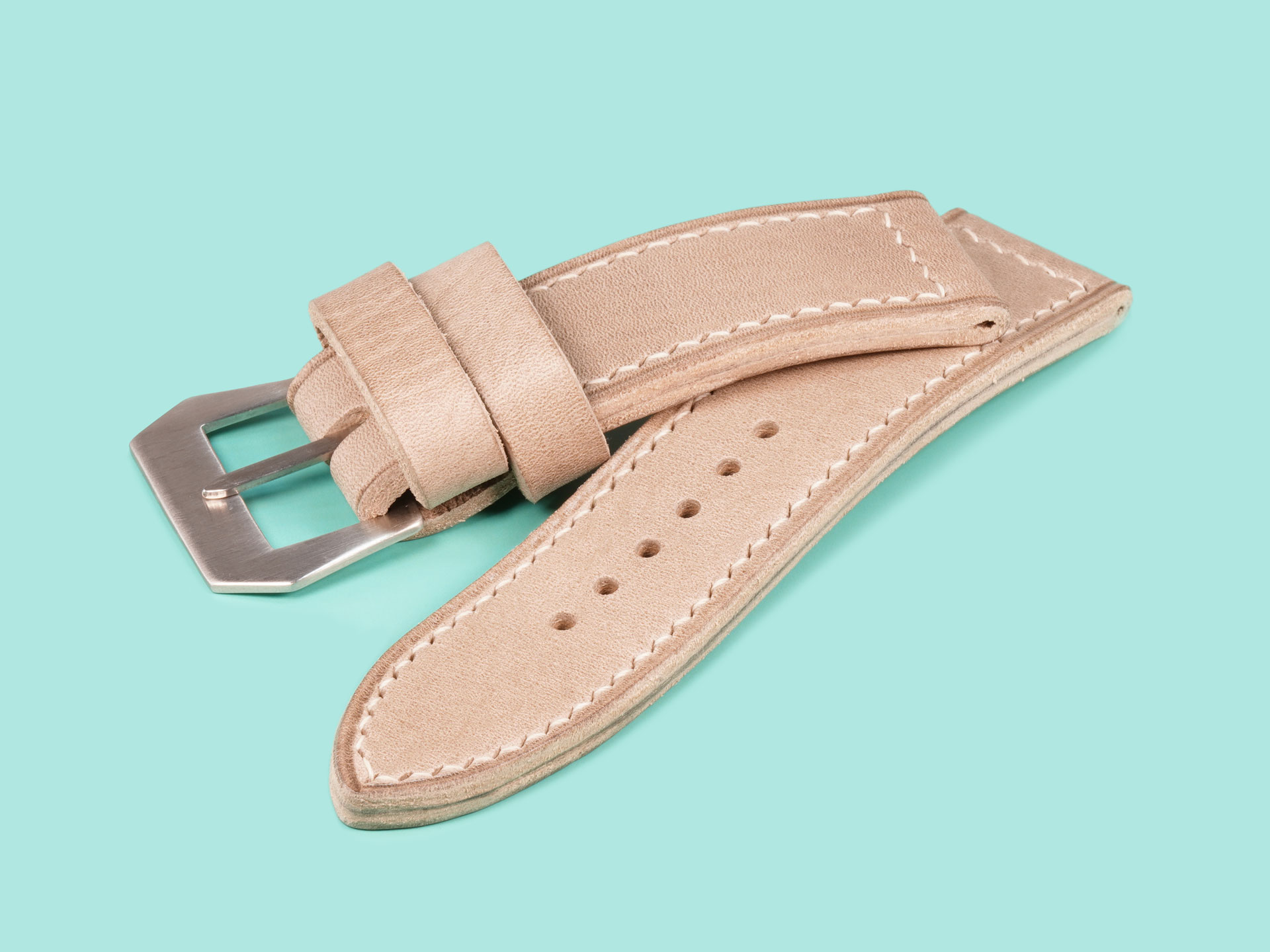 Thick grey Panerai strap profile view showing hand-burnished edge on Luminor 47mm.