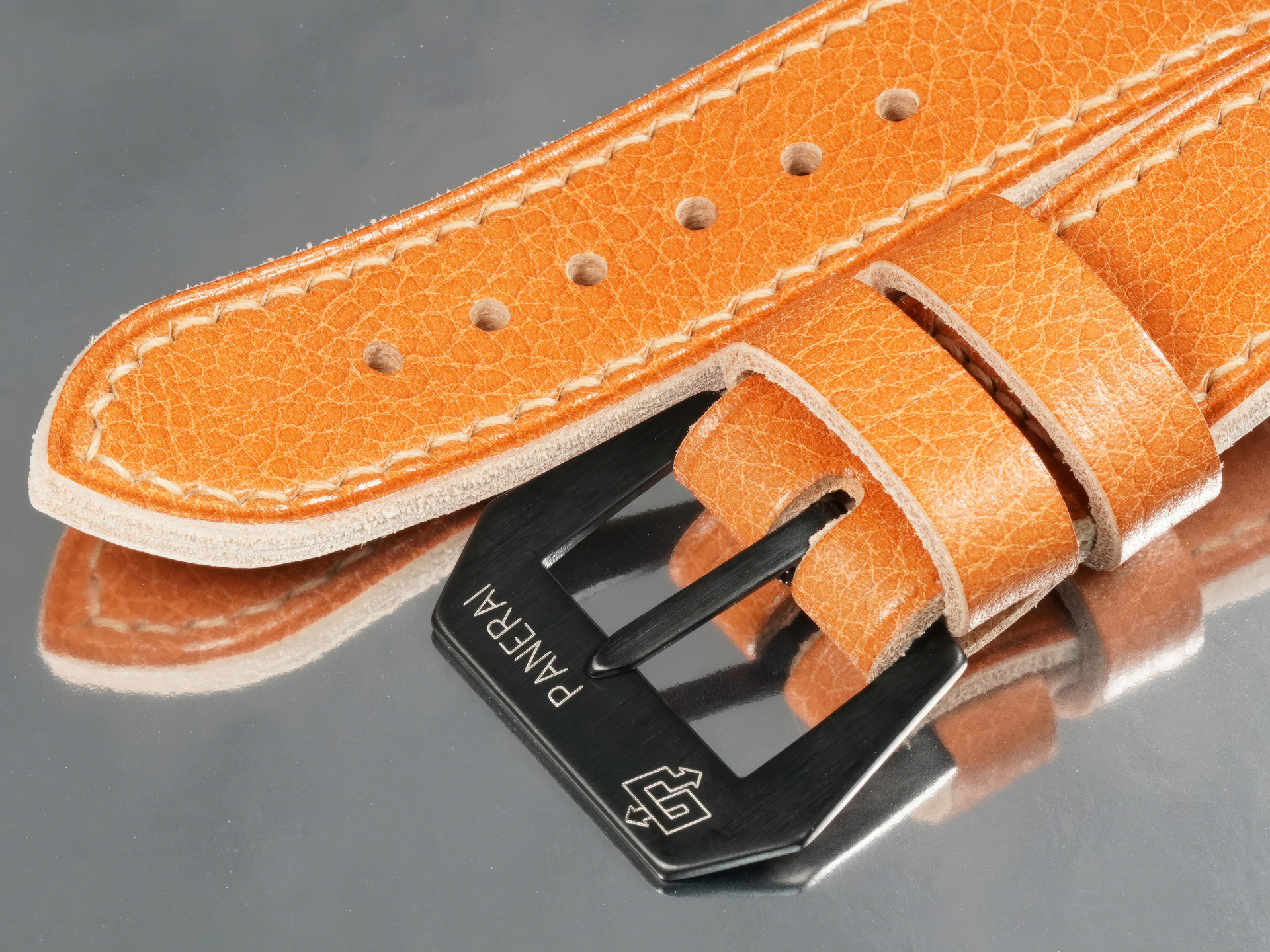 Macro detail of bespoke tan leather strap for 44mm Panerai Luminor PAM05218