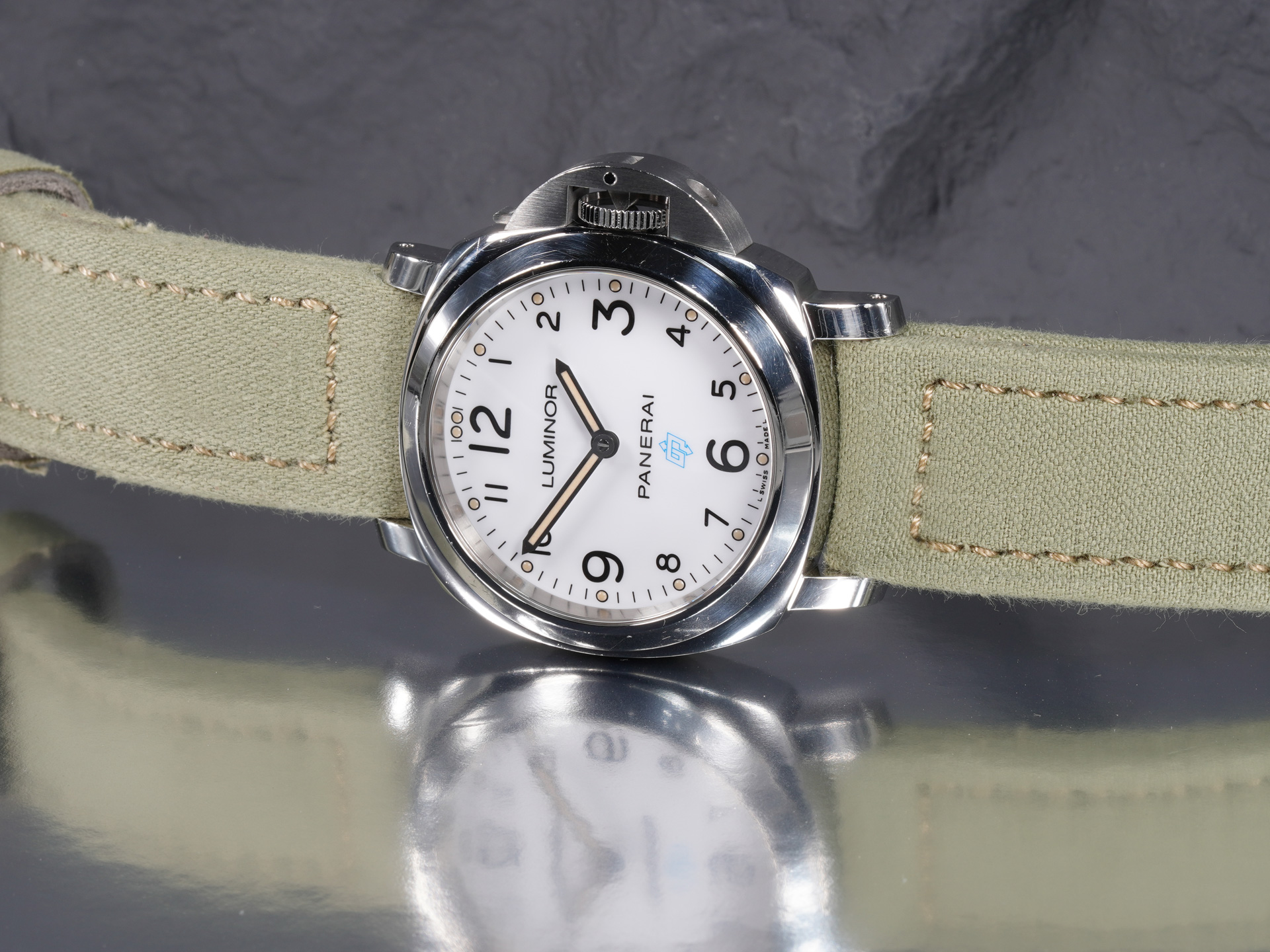 Artisanal 44mm light green canvas strap with ecru stitching on Panerai Luminor PAM00775