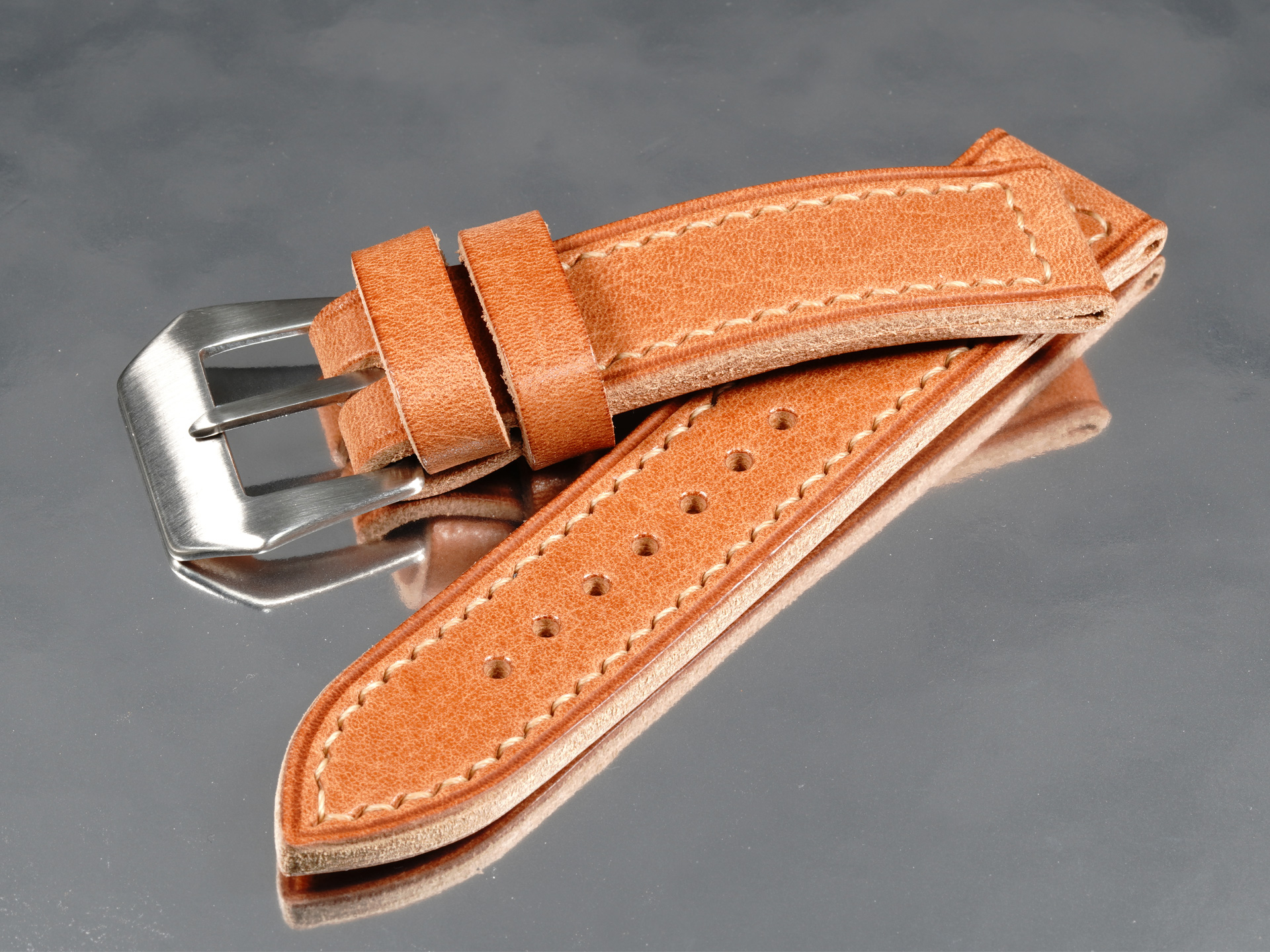 Top-down view of 42mm Panerai Luminor custom tan leather strap flat lay