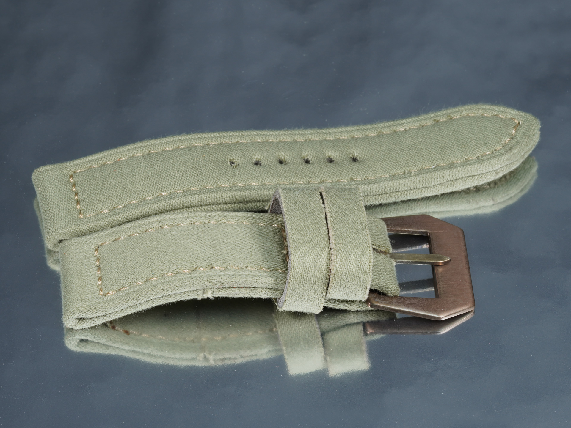 Artisanal light green canvas military style strap mounted on 44mm Panerai Luminor
