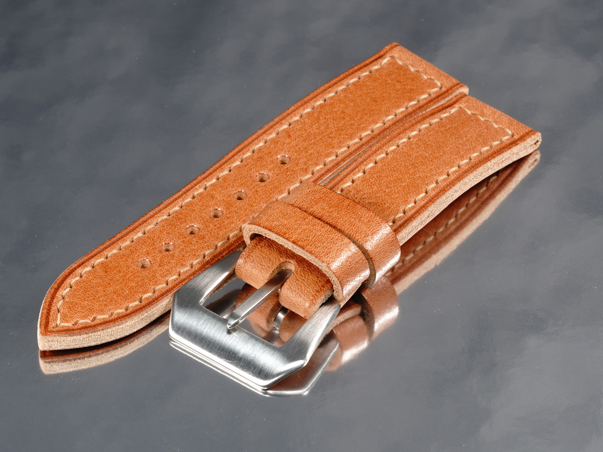Vintage pin buckle attached to tan leather strap for Panerai PAM01710